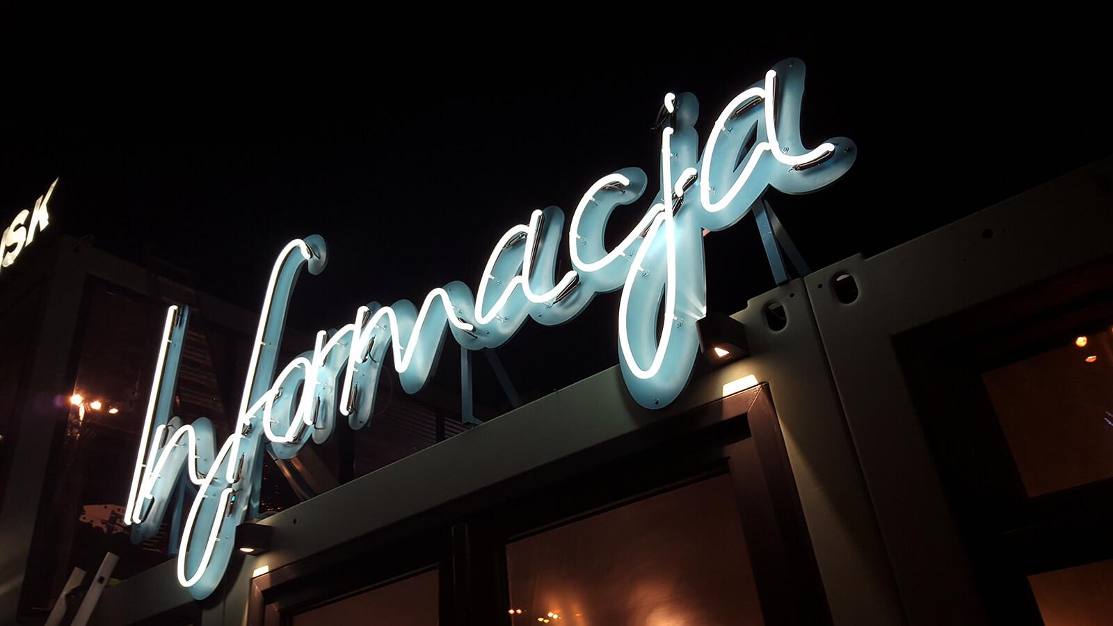 Forum Gdansk - information inscription created from neon signs, mounted on a frame, located above the entrance