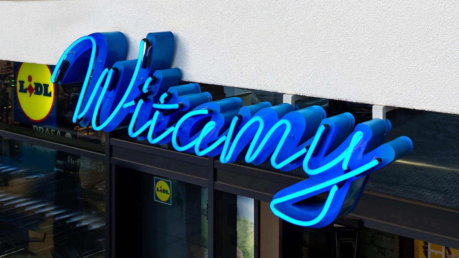 Insegna al neon "Welcome" Lidl - Pretende Varsavia