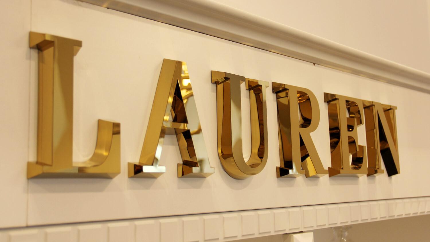 Ralph Lauren - gold spatial letters made of stainless steel sheeting