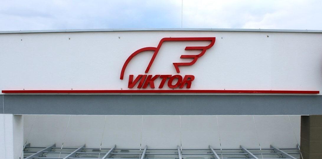 Viktor - logo and LED light space letters placed above the entrance