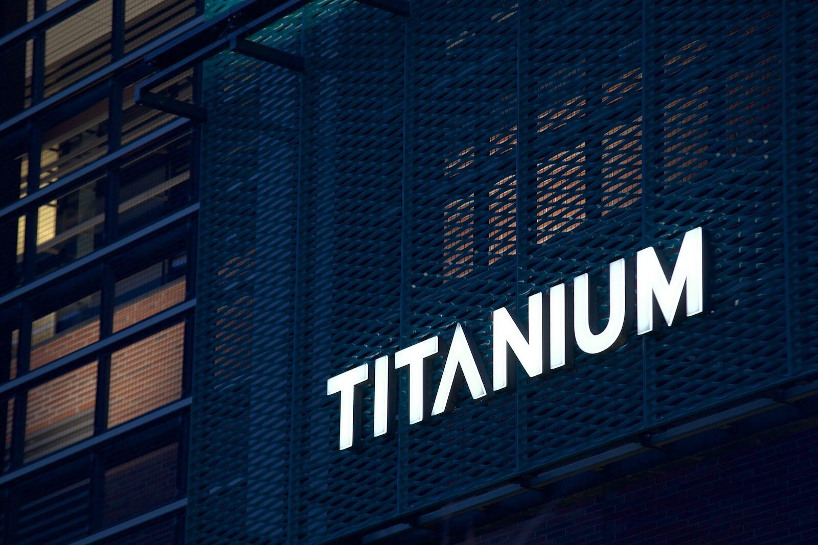 Titanium - spatial lettering glowing above the entrance