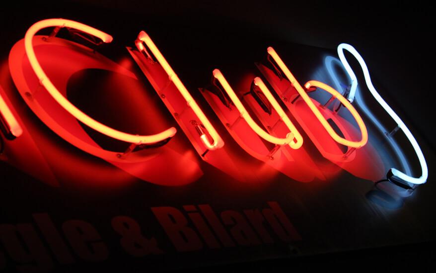 Bowl Club - neon advertising sign, placed outside the building