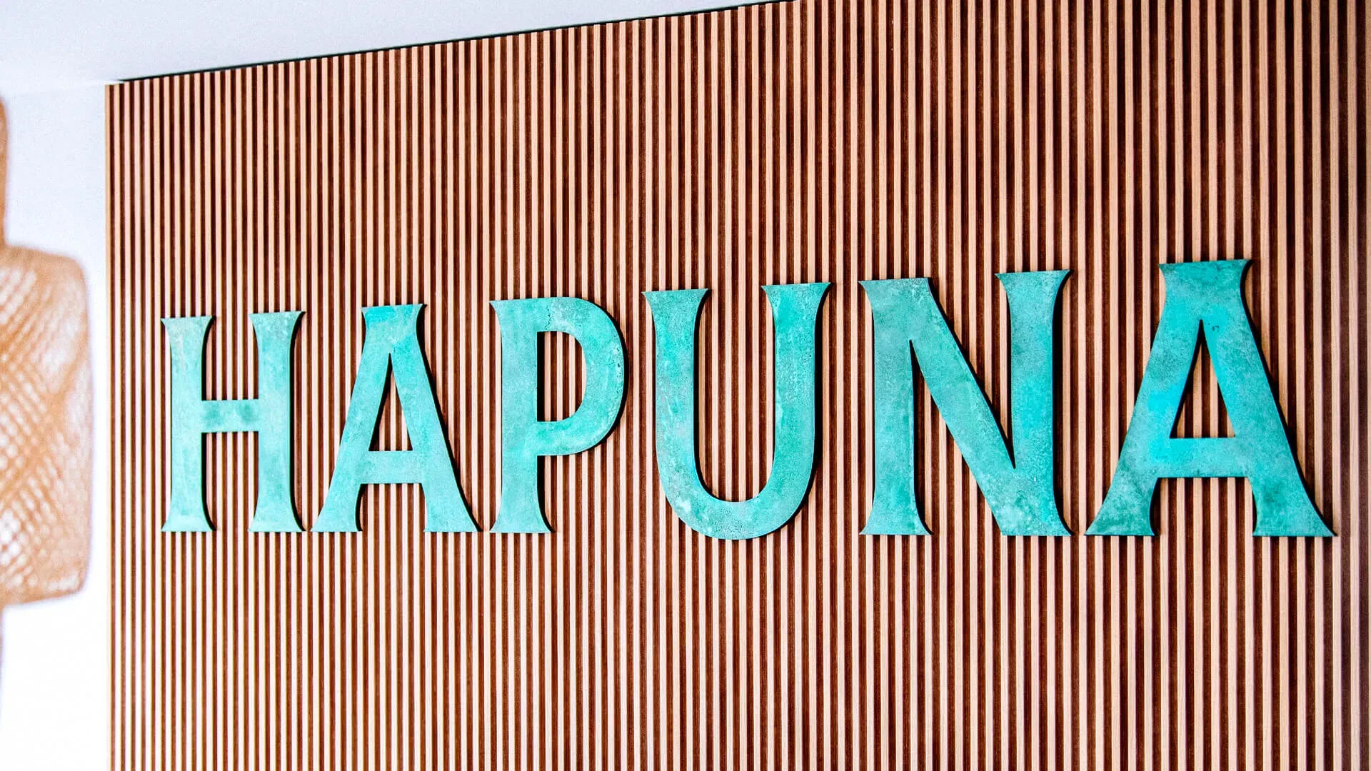 Hapuna - word made of metal in industrial style covered with patina