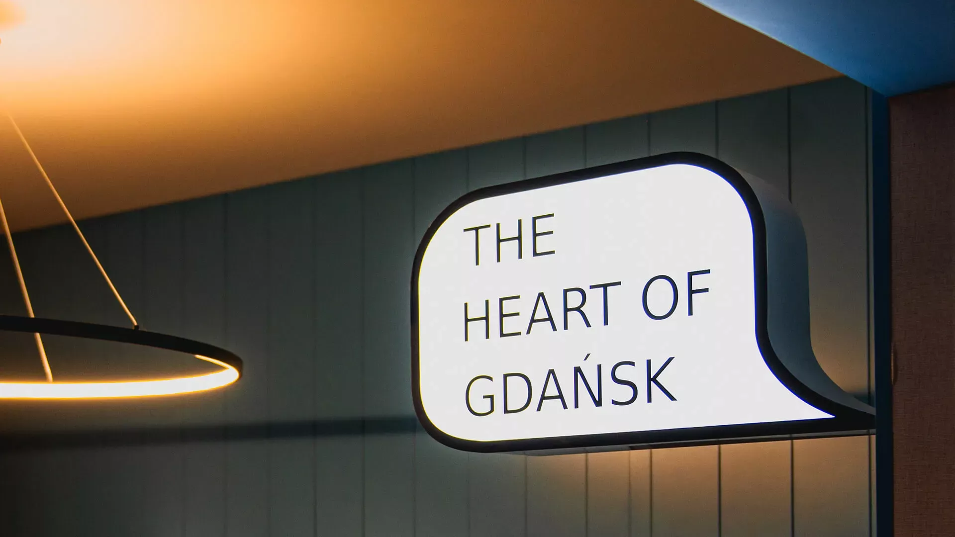 The heart of Gdansk - white plafond in the shape of a cloud with the inscription.