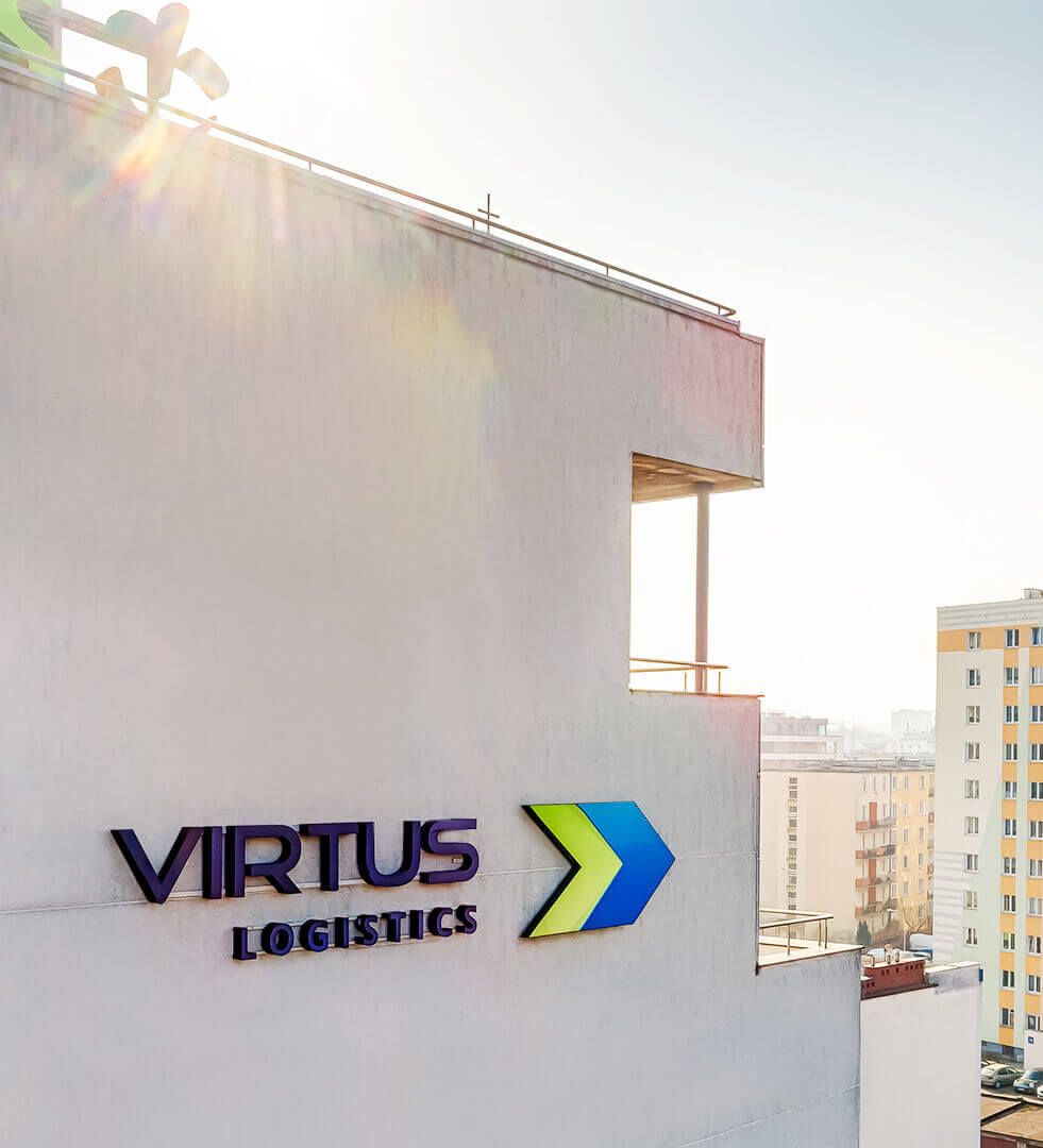 virtus - Virtus_Logistics_lighting_letters_assembled_alpinistically_to_the_elevation_of_the_building