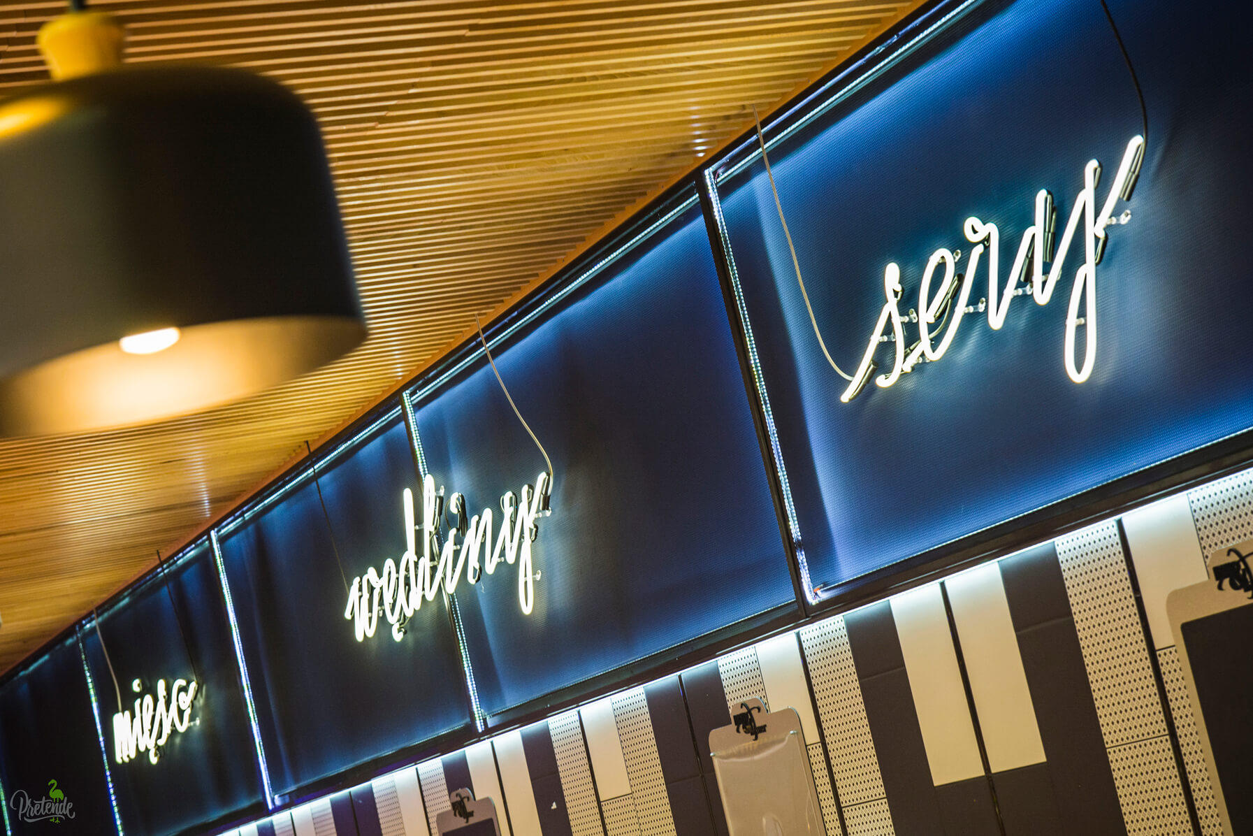 neon-vegetables-meat-cheese-neon-in-a-food-store-neon-behind-the-counter-neon-on-the-wall-of-the-store-inside-neon-lettering-neon-neon-over-the-head-neon-on-the-stool-max-xavier-store-gdansk