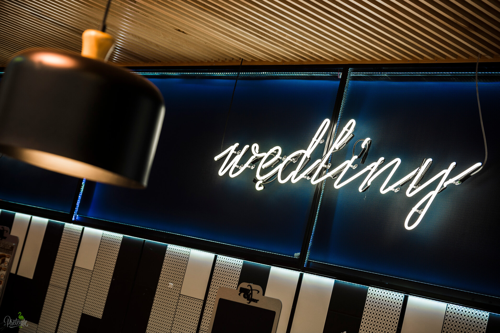 neon-wedlines-neon-in-store-neon-behind-the-counter-neon-on-the-wall-of-the-store-inside-neon-lettering-neon-over-the-head-neon-on-the-stool-max-xavier-store-gdansk