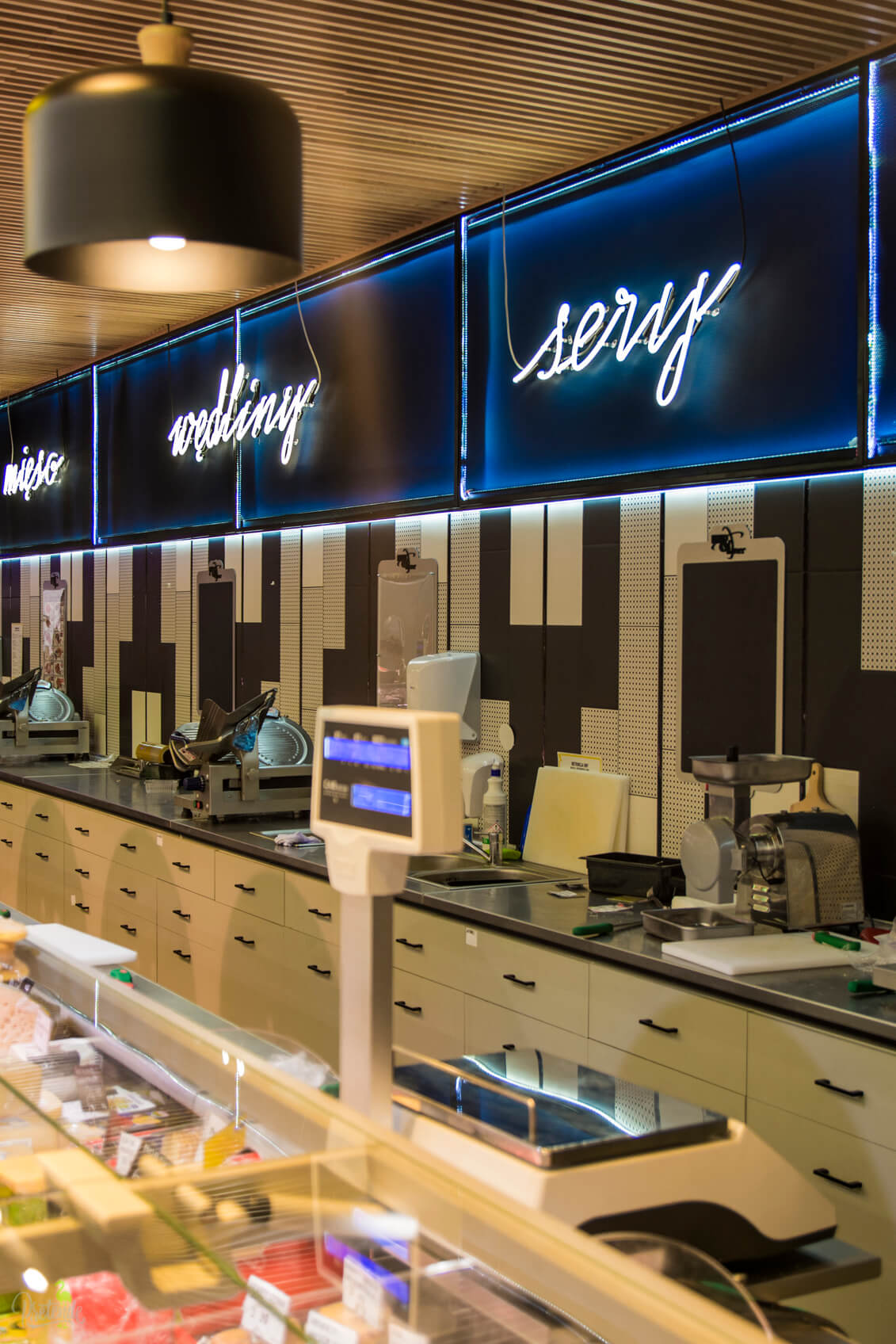 neon-vegetables-meat-cheese-neon-in-a-food-store-neon-behind-the-counter-neon-on-the-wall-of-the-store-inside-neon-lettering-neon-neon-over-the-head-neon-on-the-stool-max-xavier-store-gdansk