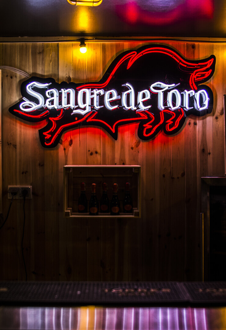 neon-on-a-order-sangre-the-torro-neon-on-a-bar-bar-neon-plex-red-glass-mass-tinted-red-neon-on-desks-electric