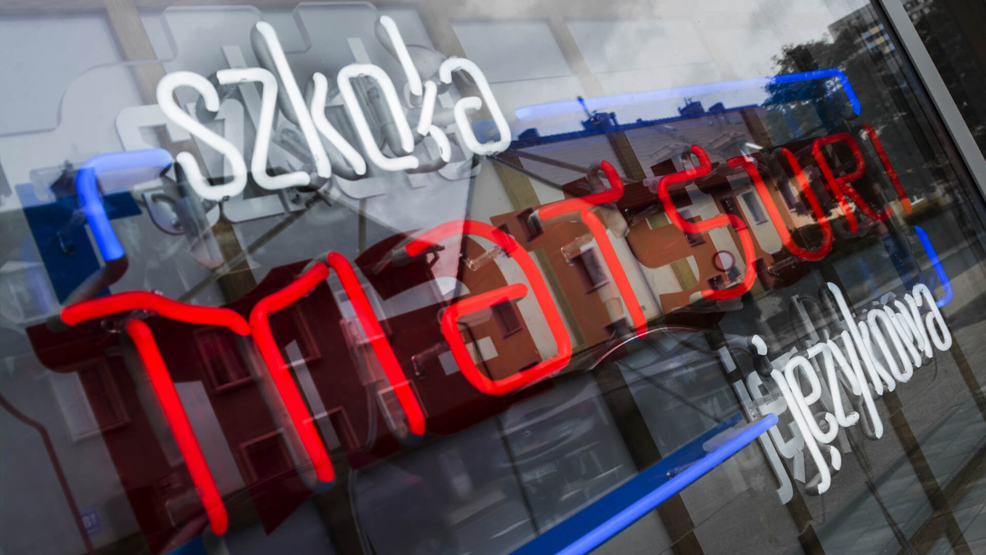 matsuri-school-linguistic-neon-on-plexi-hanging-behind-theglass-neon-at-theentry-neon-colour-logo-firm-neon-low-neon-on-exhibition-neon-in-office-redglass-gdansk-przymorze