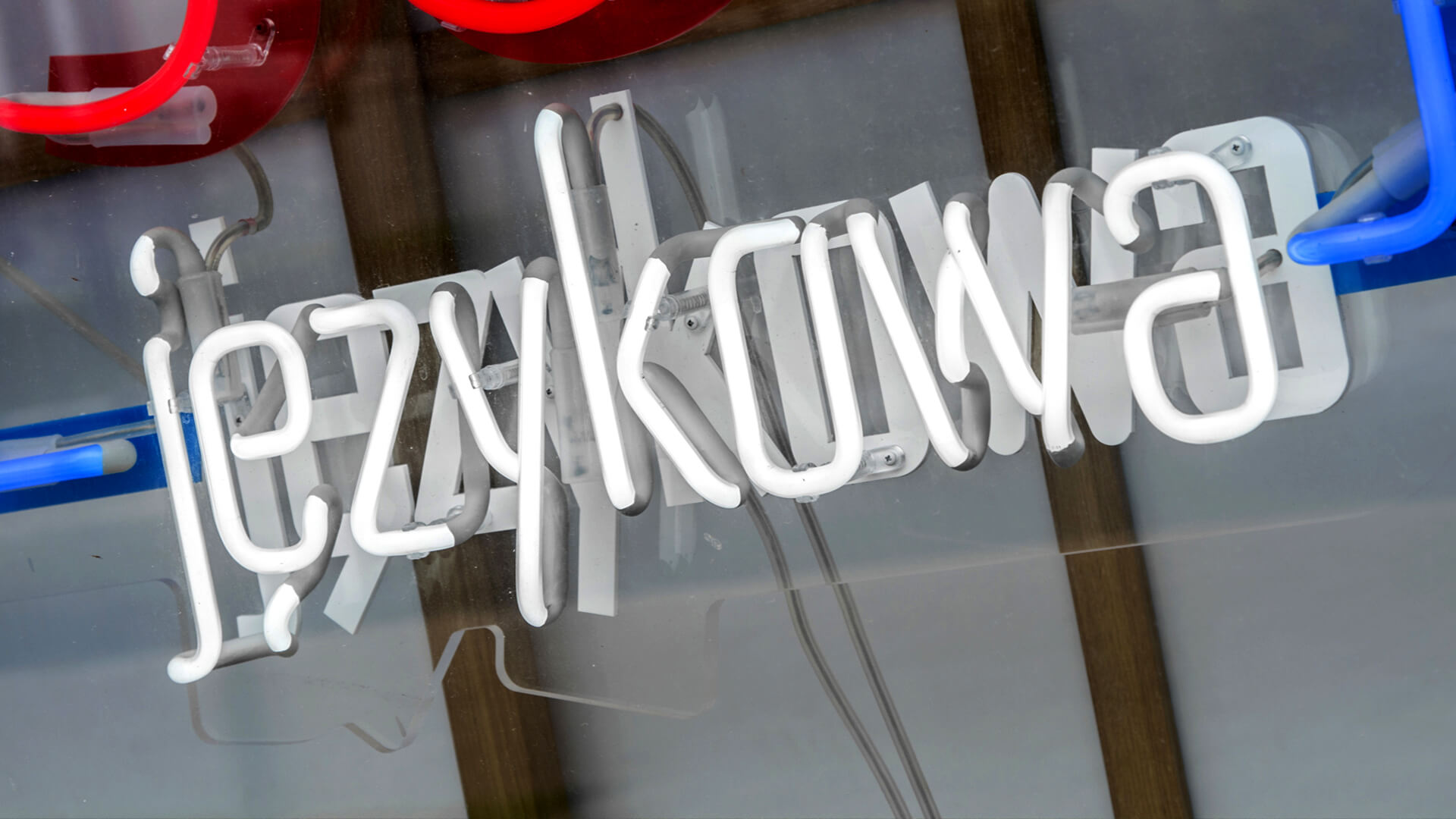 matsuri-language-school-neon-on-plexi-hanging-behind-the-glass-neon-at-the-entry-neon-colorful-logo-firm-neon-low-neon-on-exhibition-neon-in-office-red-glass-gdansk-przymorze