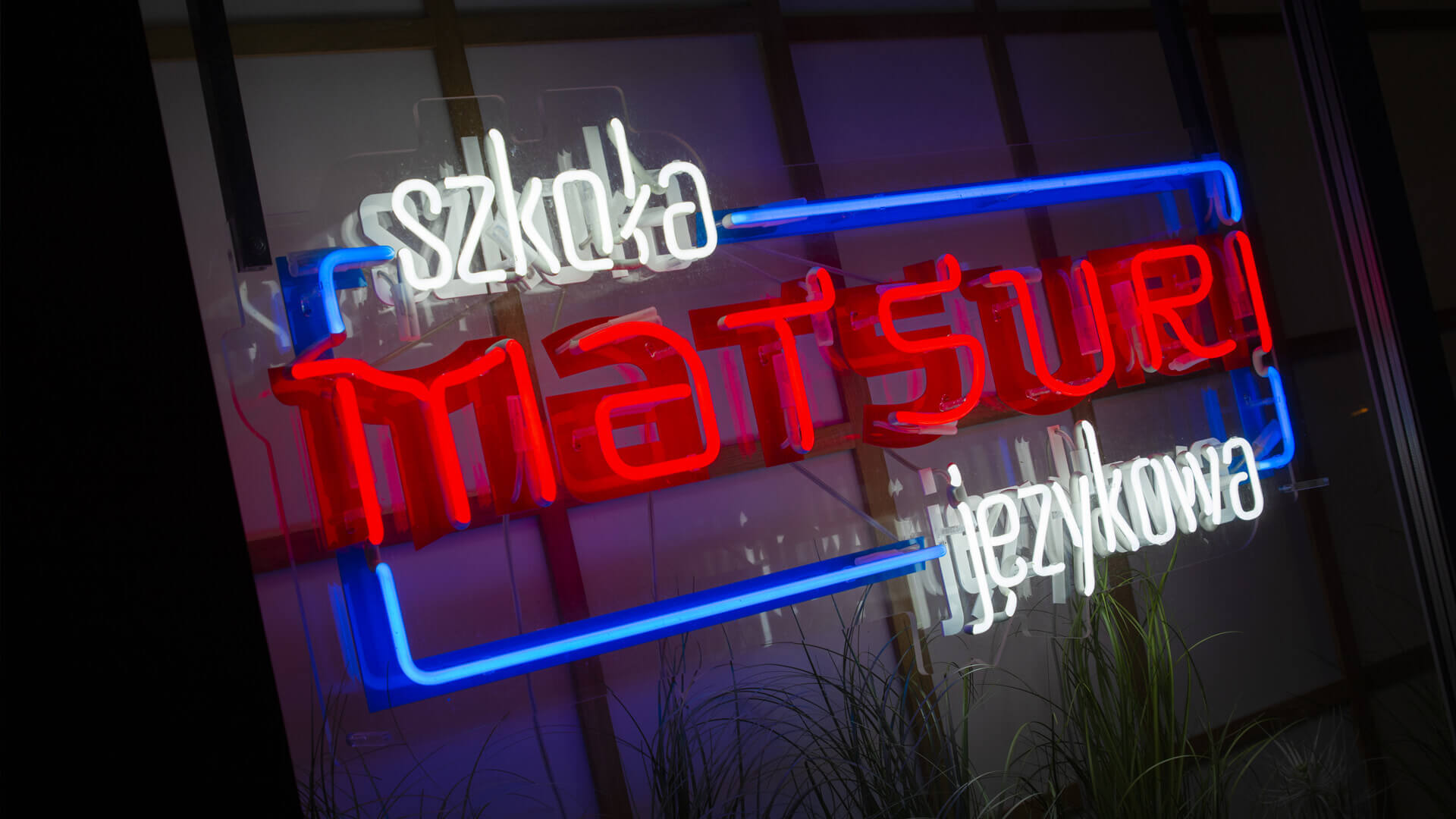 matsuri-language-school-neon-on-plexi-hanging-behind-the-glass-neon-at-the-entry-neon-colorful-logo-firm-neon-low-neon-on-exhibition-neon-in-office-red-glass-gdansk-przymorze