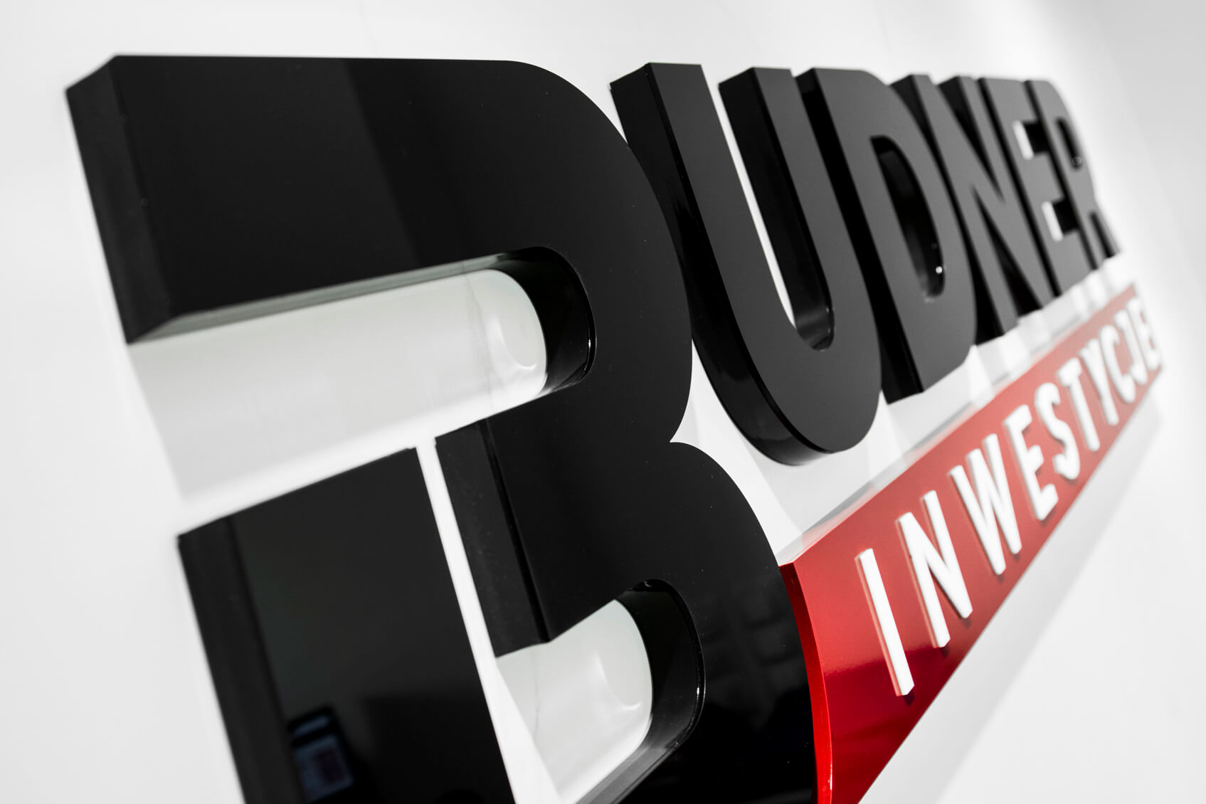 Budner Investments - logo and 3D space letters placed on the wall