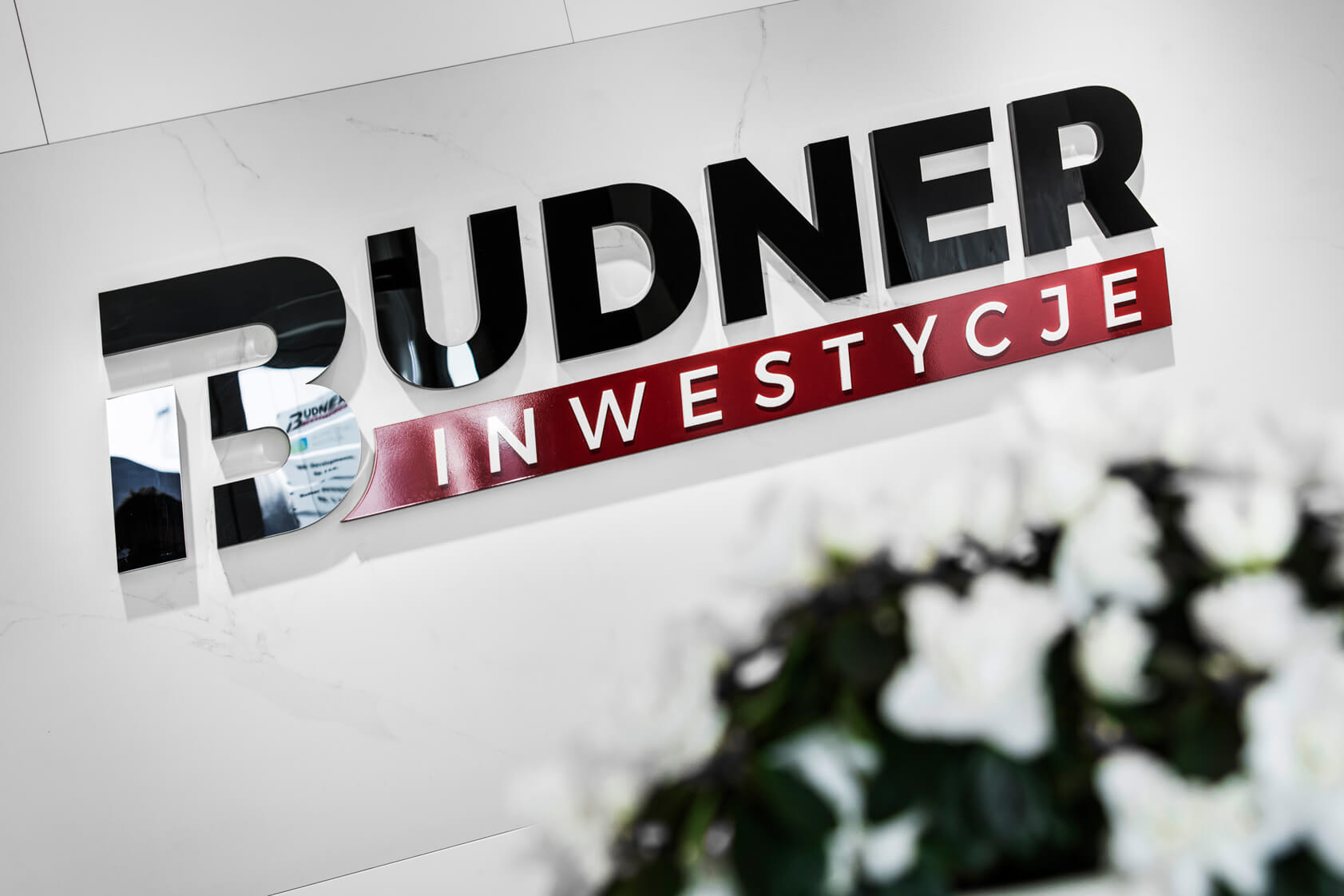 Budner Investments - logo and 3D space letters placed on the wall