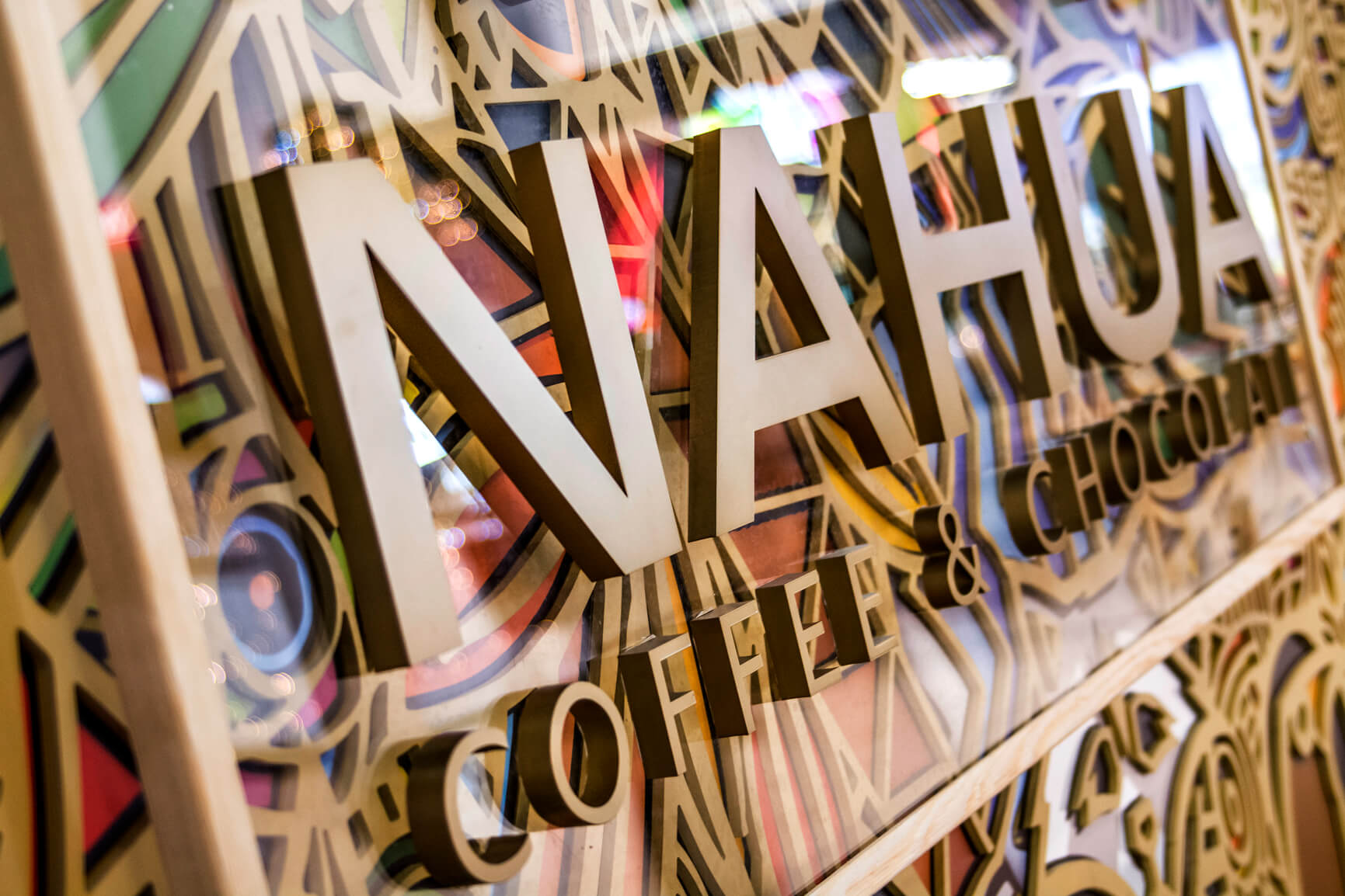 Nahua - 3D logo and spatial letters made of plexiglass placed on plexiglass backing mounted on spacers