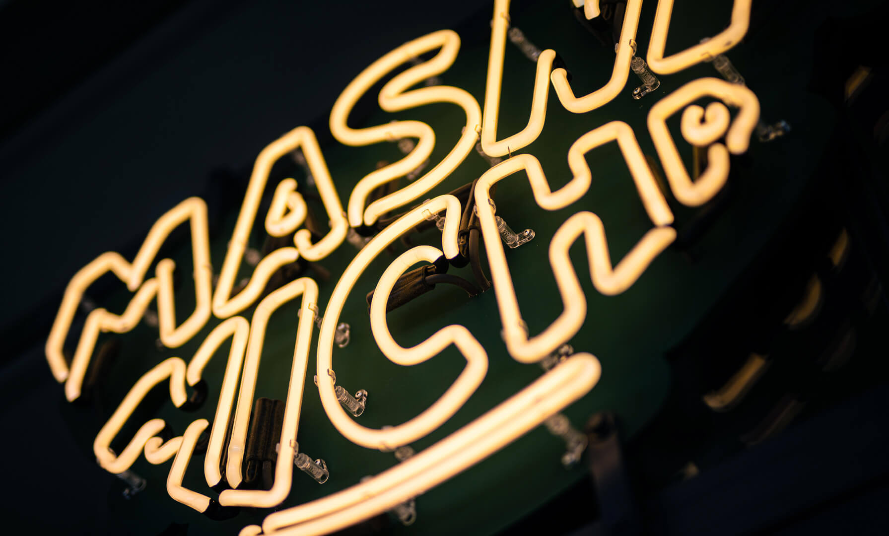 Neon sign for Masna Micha restaurant in Gdansk, Poland, on the premises.