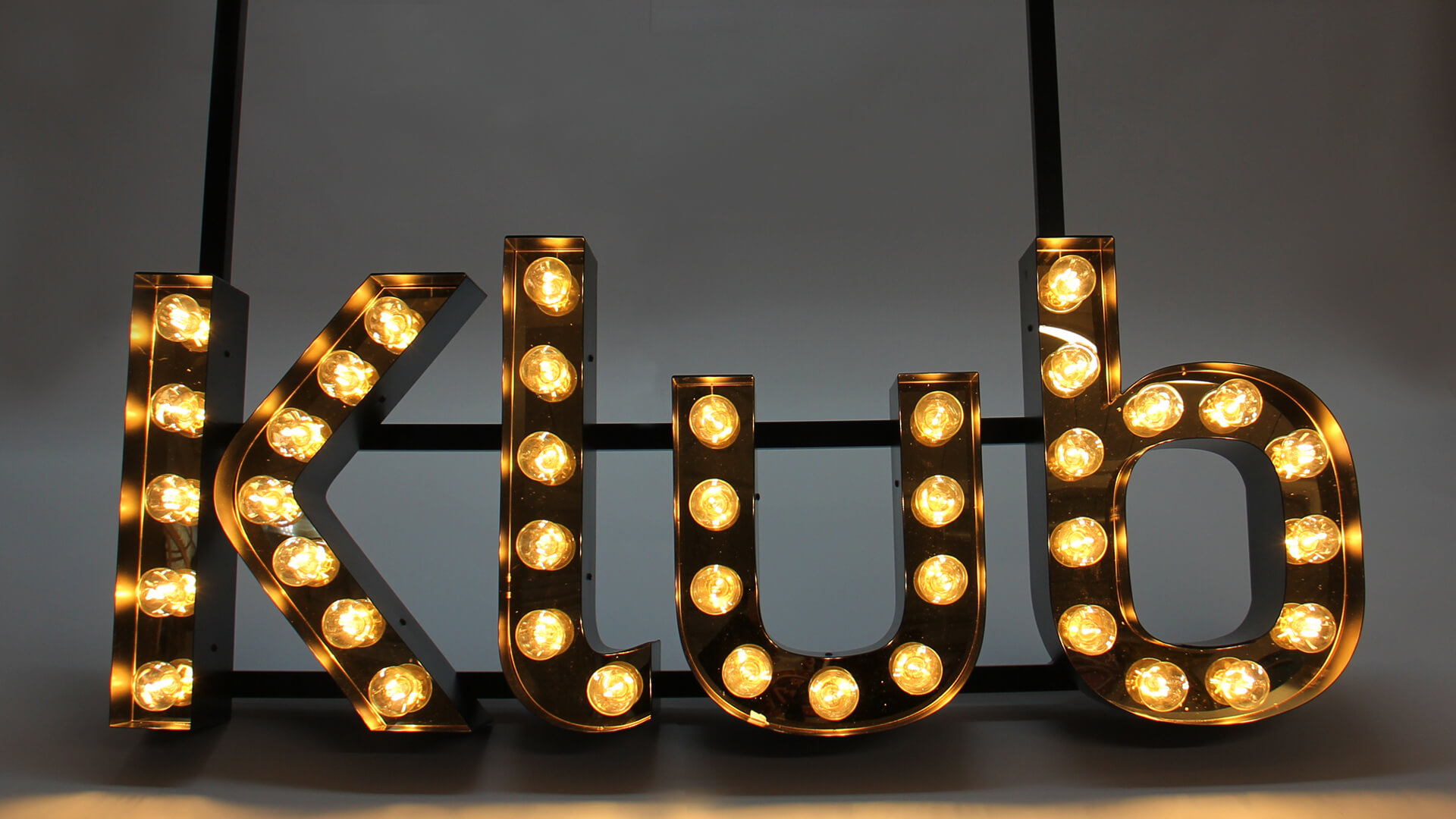 Letters with light bulbs. The Word Club.