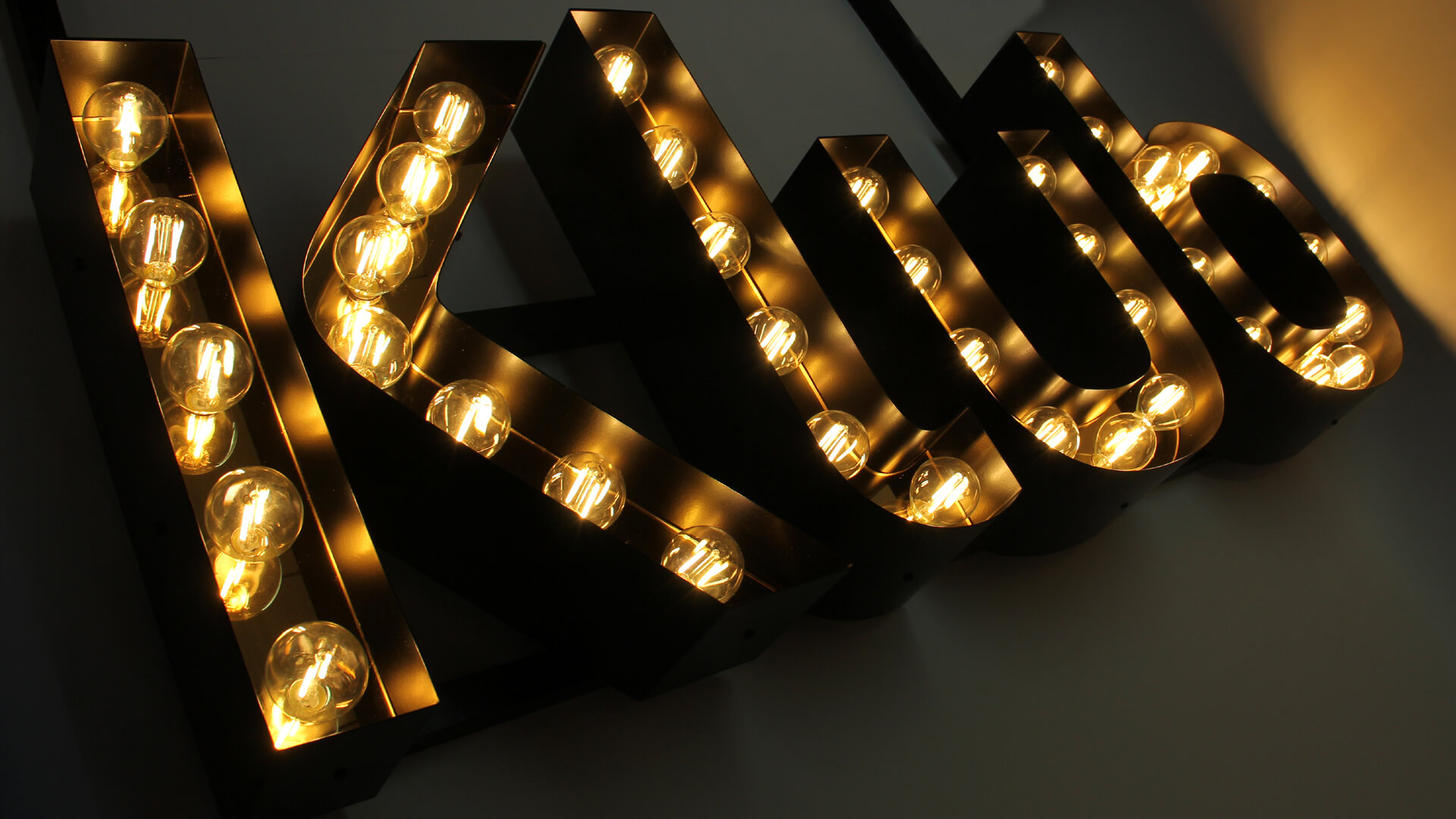 Letters with light bulbs. The Word Club.