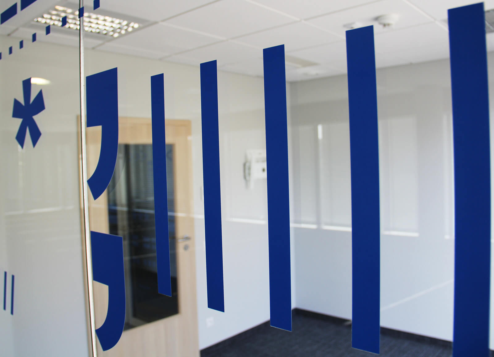 Glass covered with various shapes of foil signs