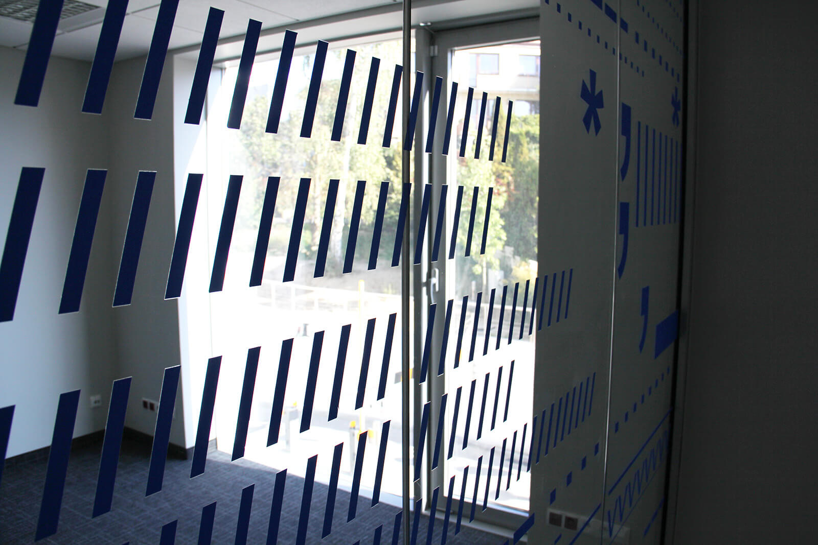 Glass covered with various shapes of foil signs