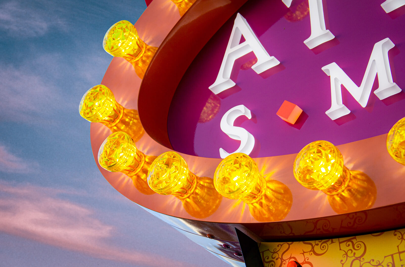 American style advertisement, signboard, semaphore. Visible vintage-style light bulbs.