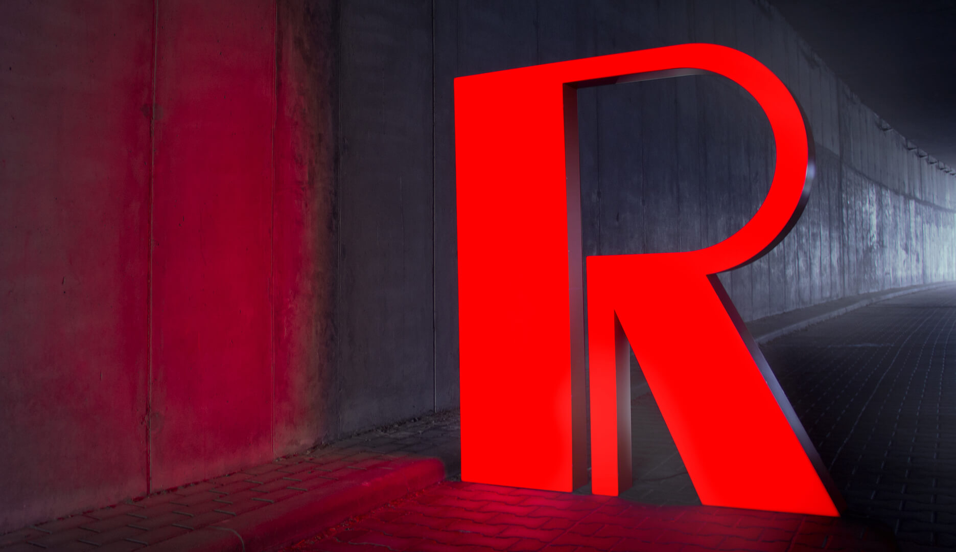 Large format letter R in red, LED backlit.