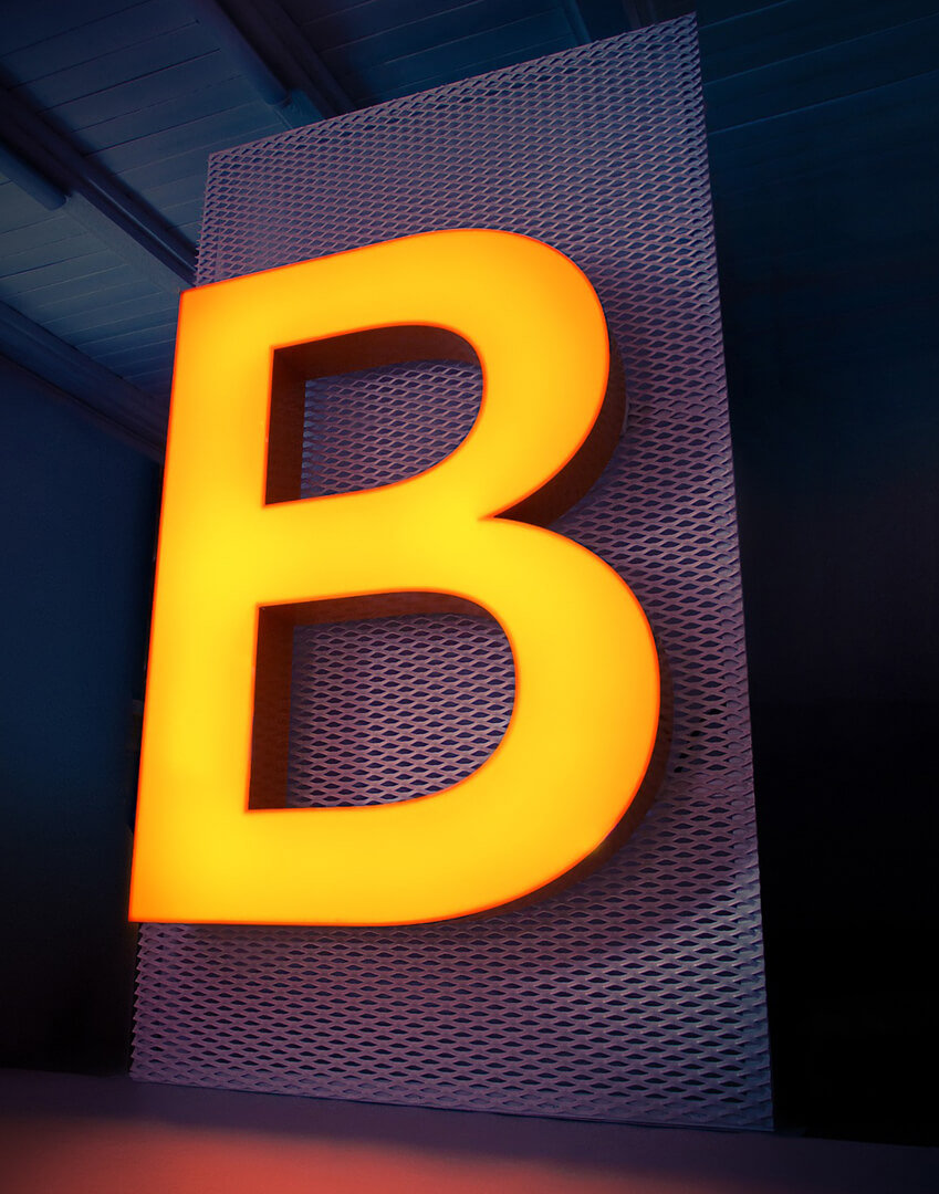 Large format standing letter B, in yellow.