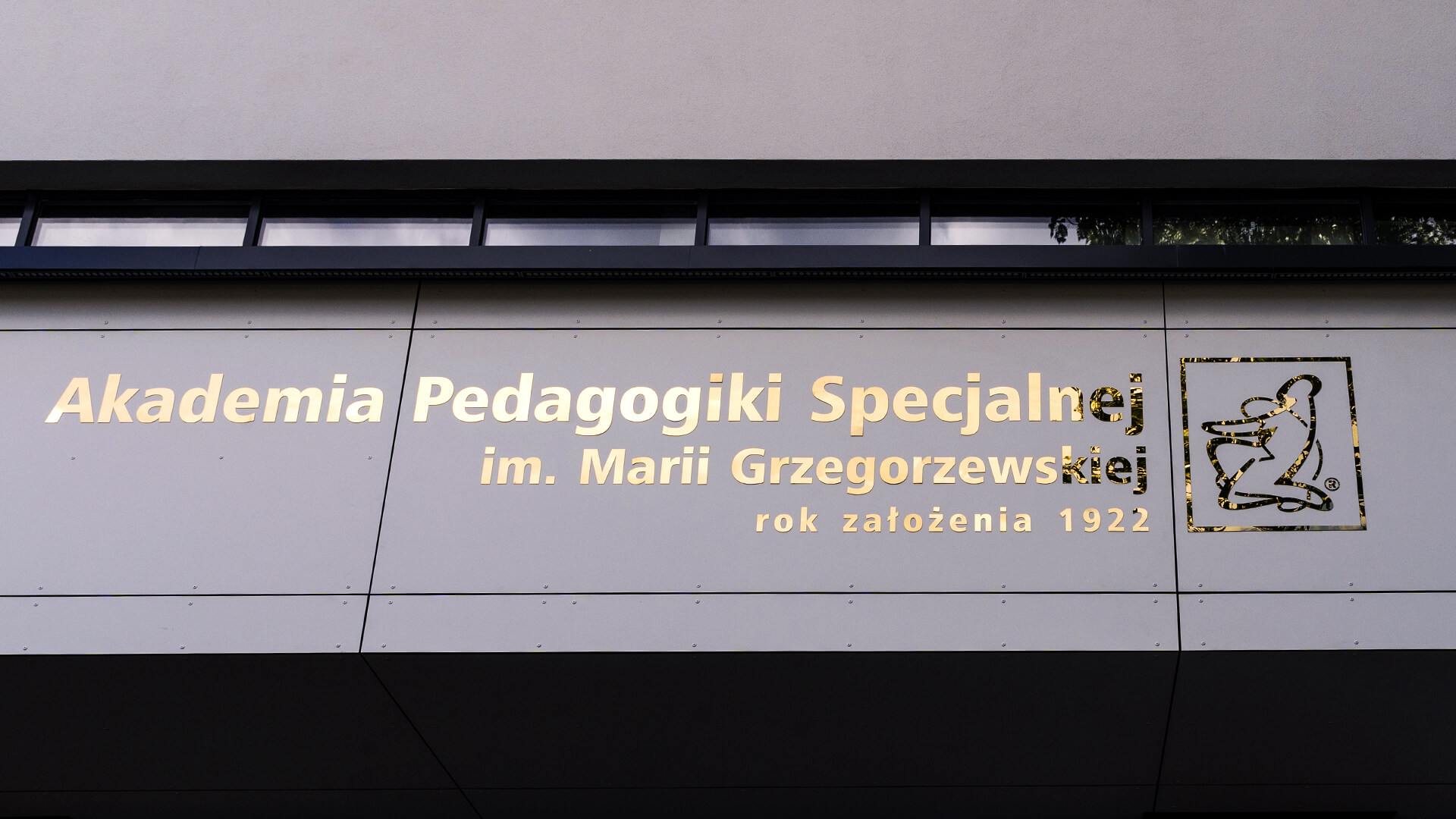 Gold stainless steel letters above the entrance.