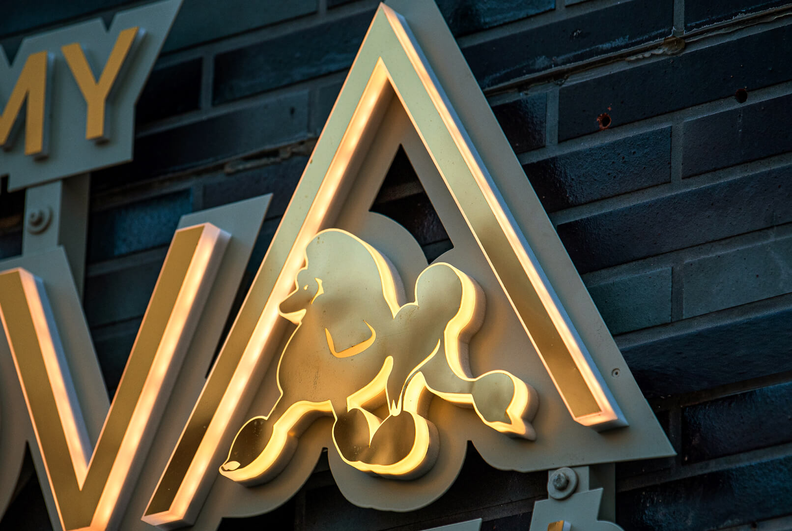 Ambernova side-lit LED letters, made of stainless steel in gold color.