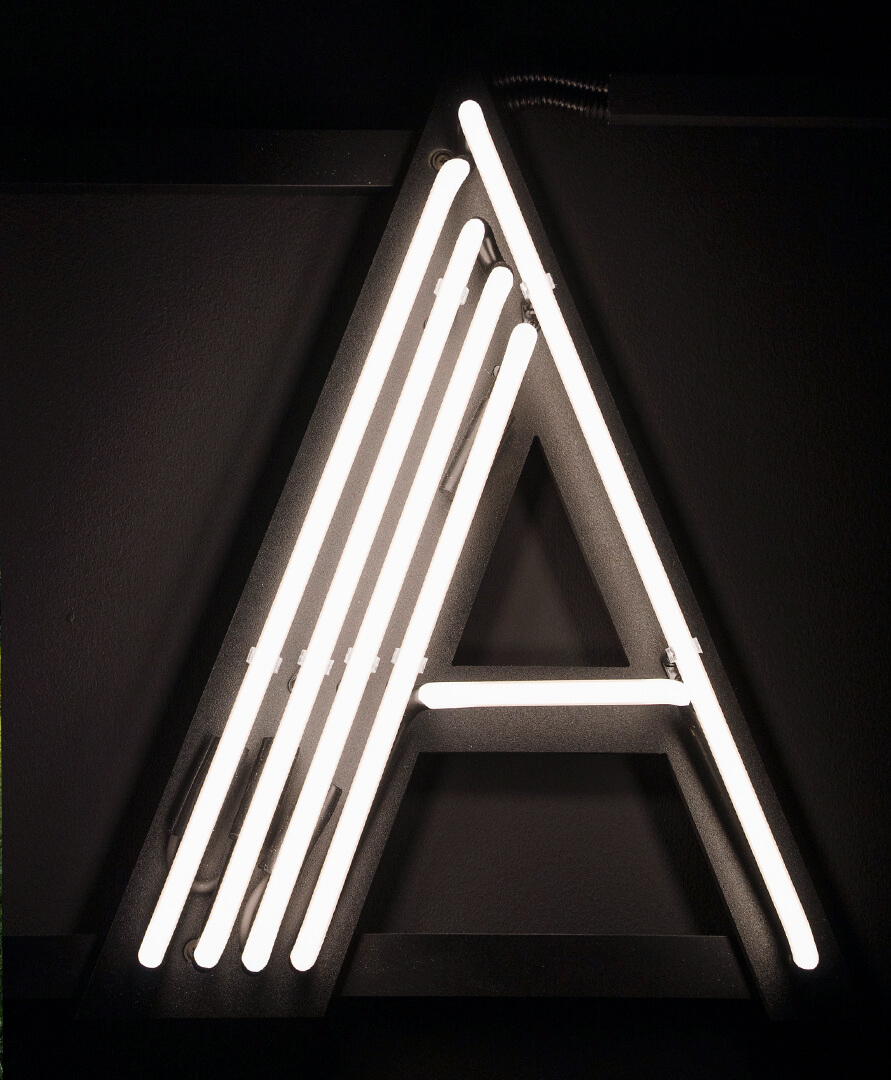 Letter A neon sign in museum white