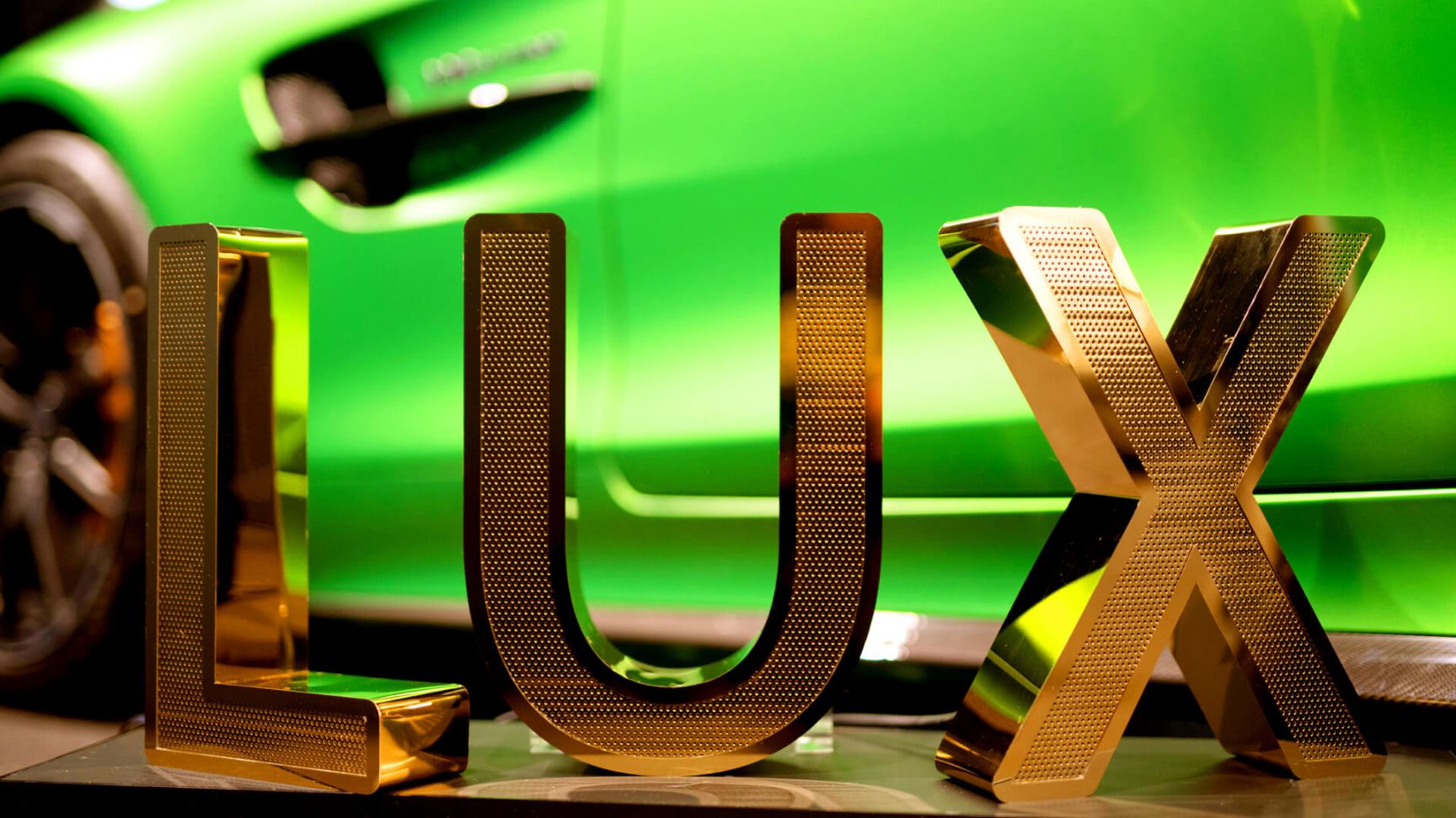 LUX lettering made of perforated stainless steel