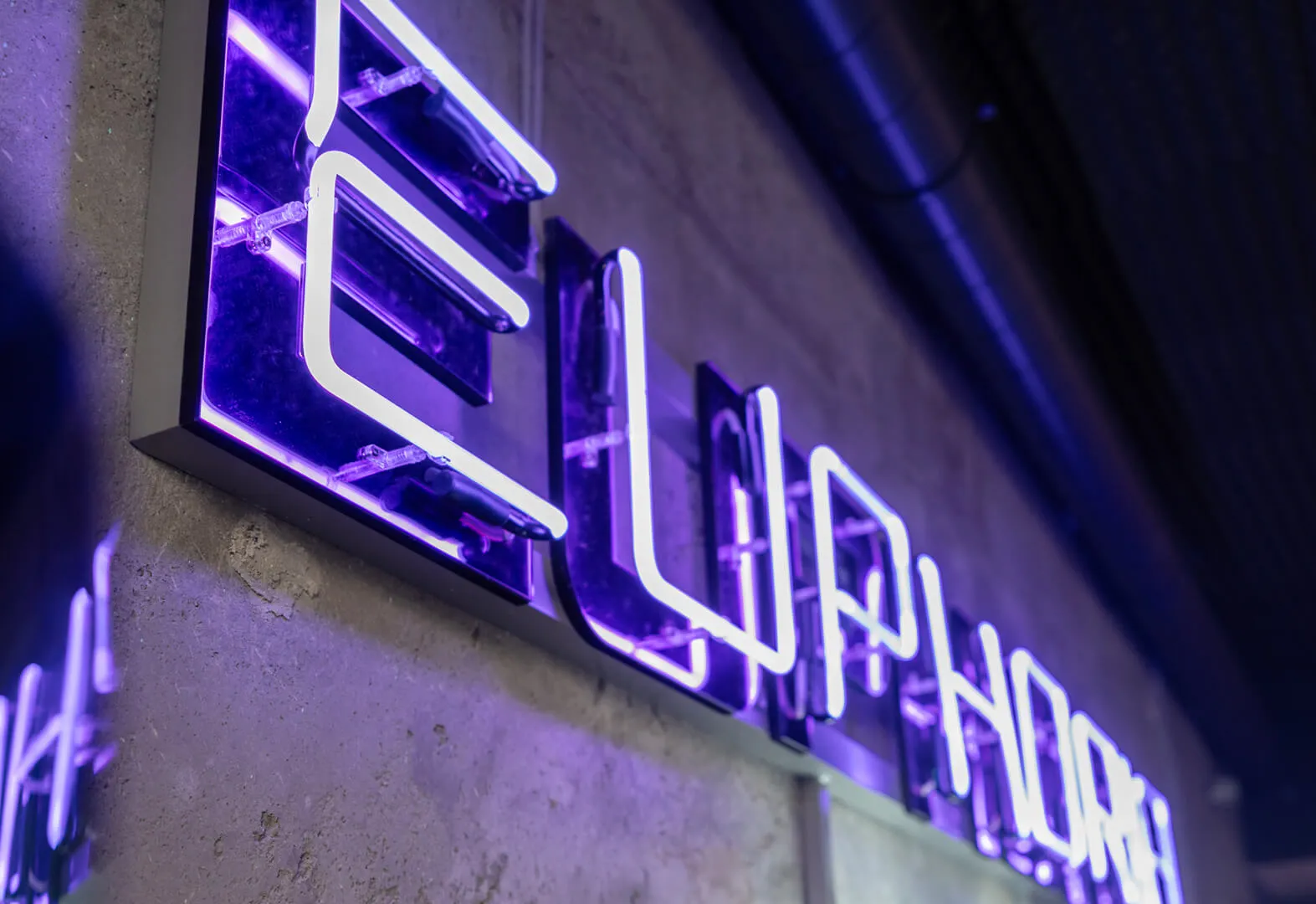 glass neon over the bar in purple color