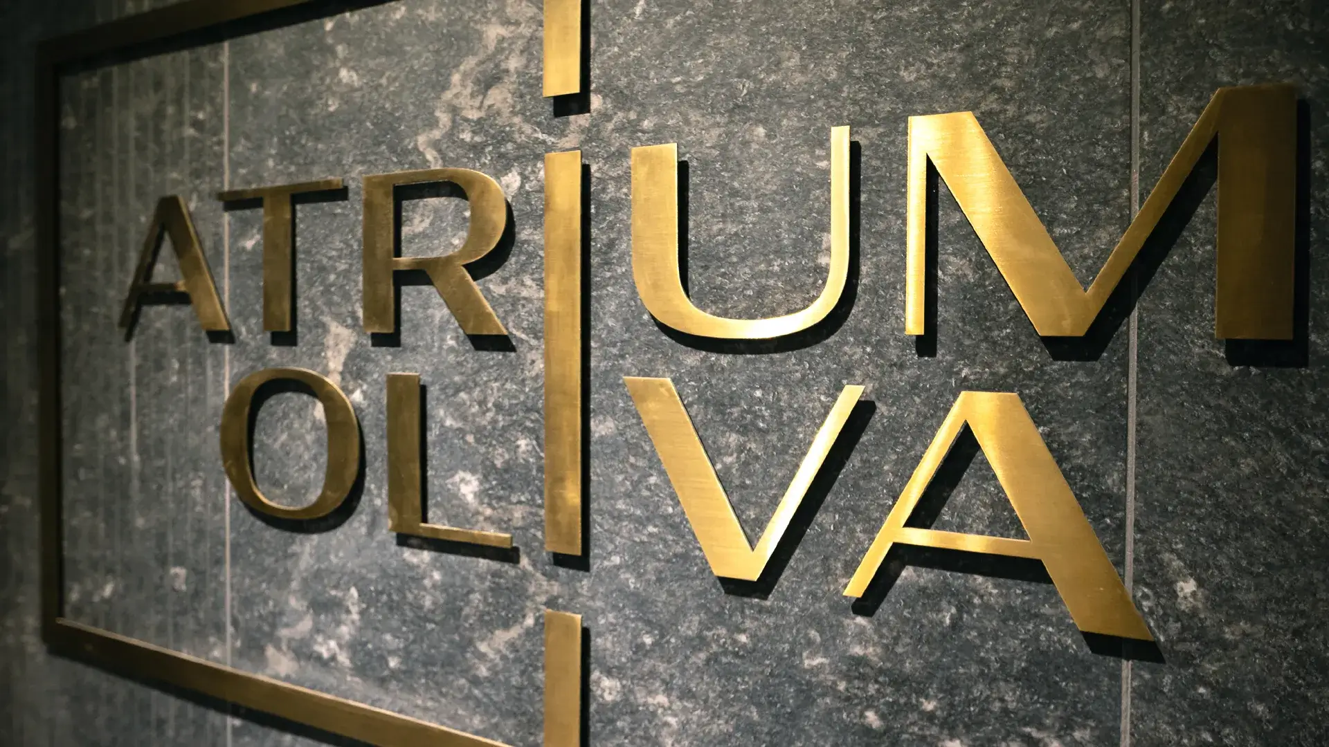 Atrium Oliva flat letters in brushed sheet metal