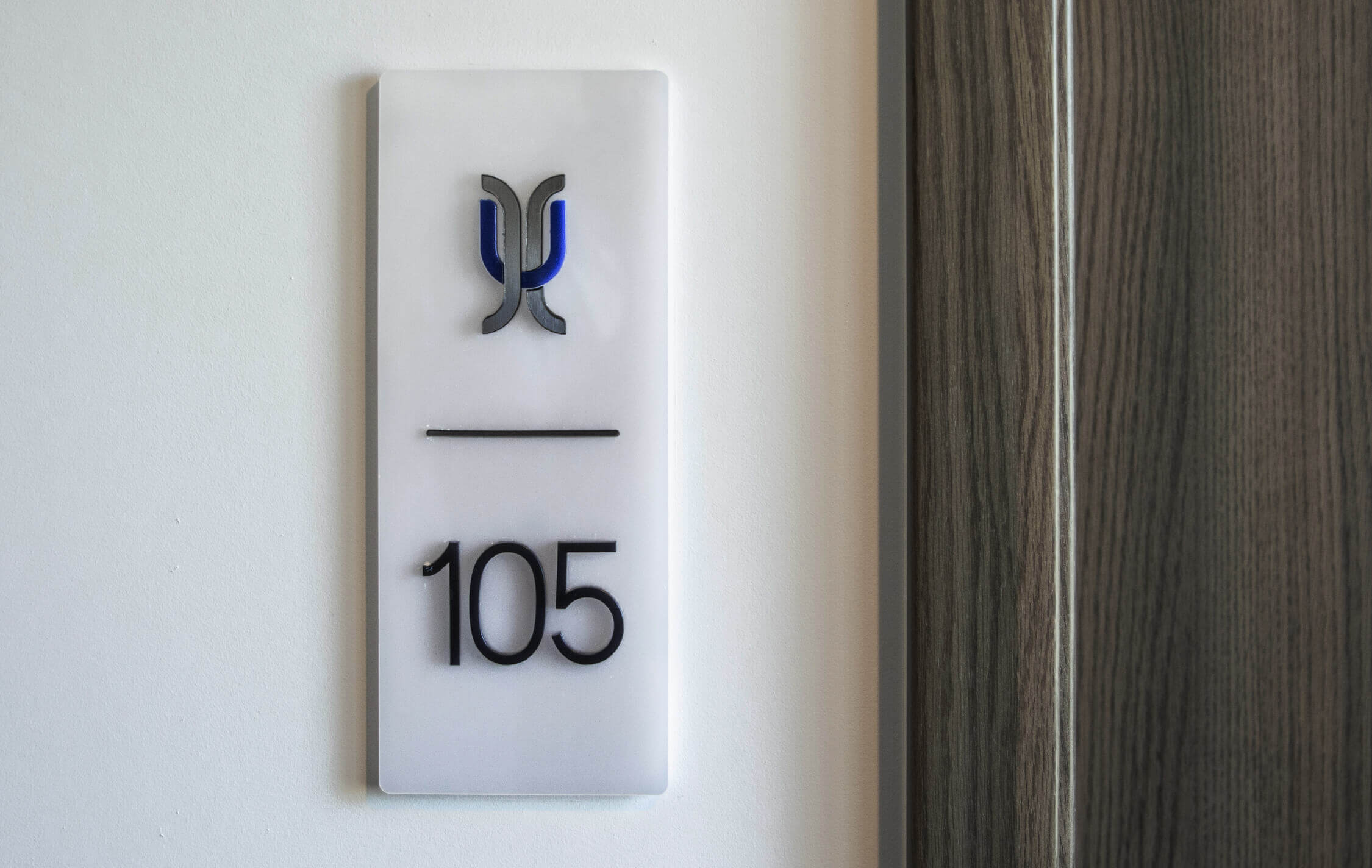 Hotel - signage of rooms with spatial letters next to the door