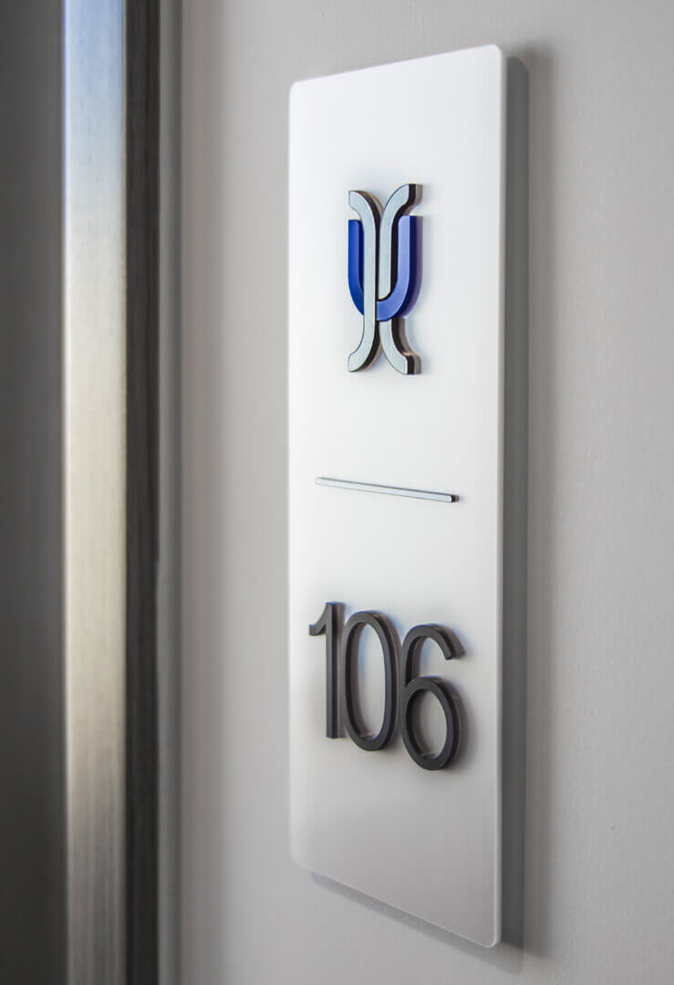 Hotel - signage of rooms with spatial letters next to the door