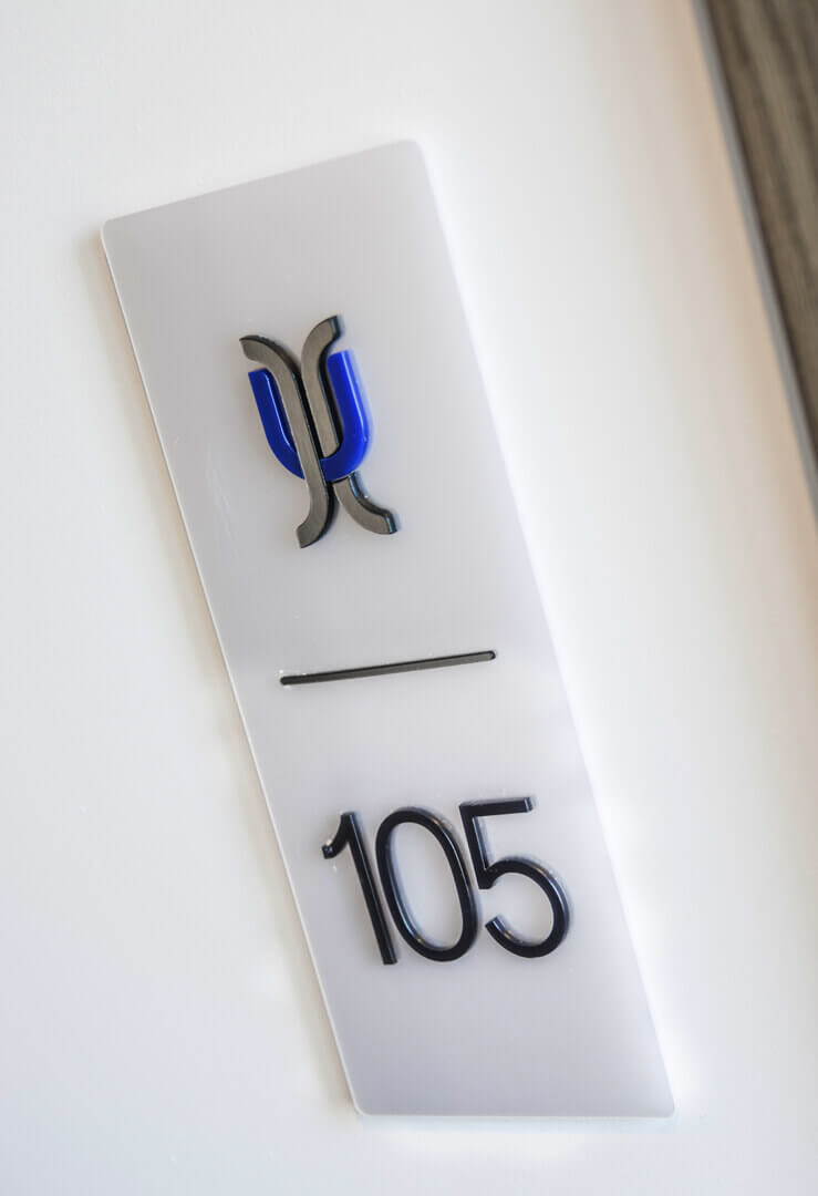 Hotel - signage of rooms with spatial letters next to the door