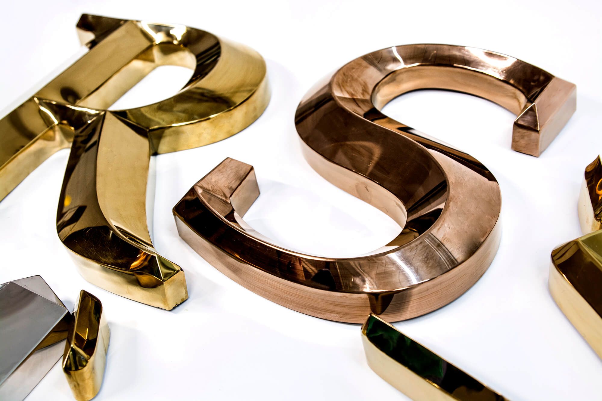 Gold prismatic letters made of metal