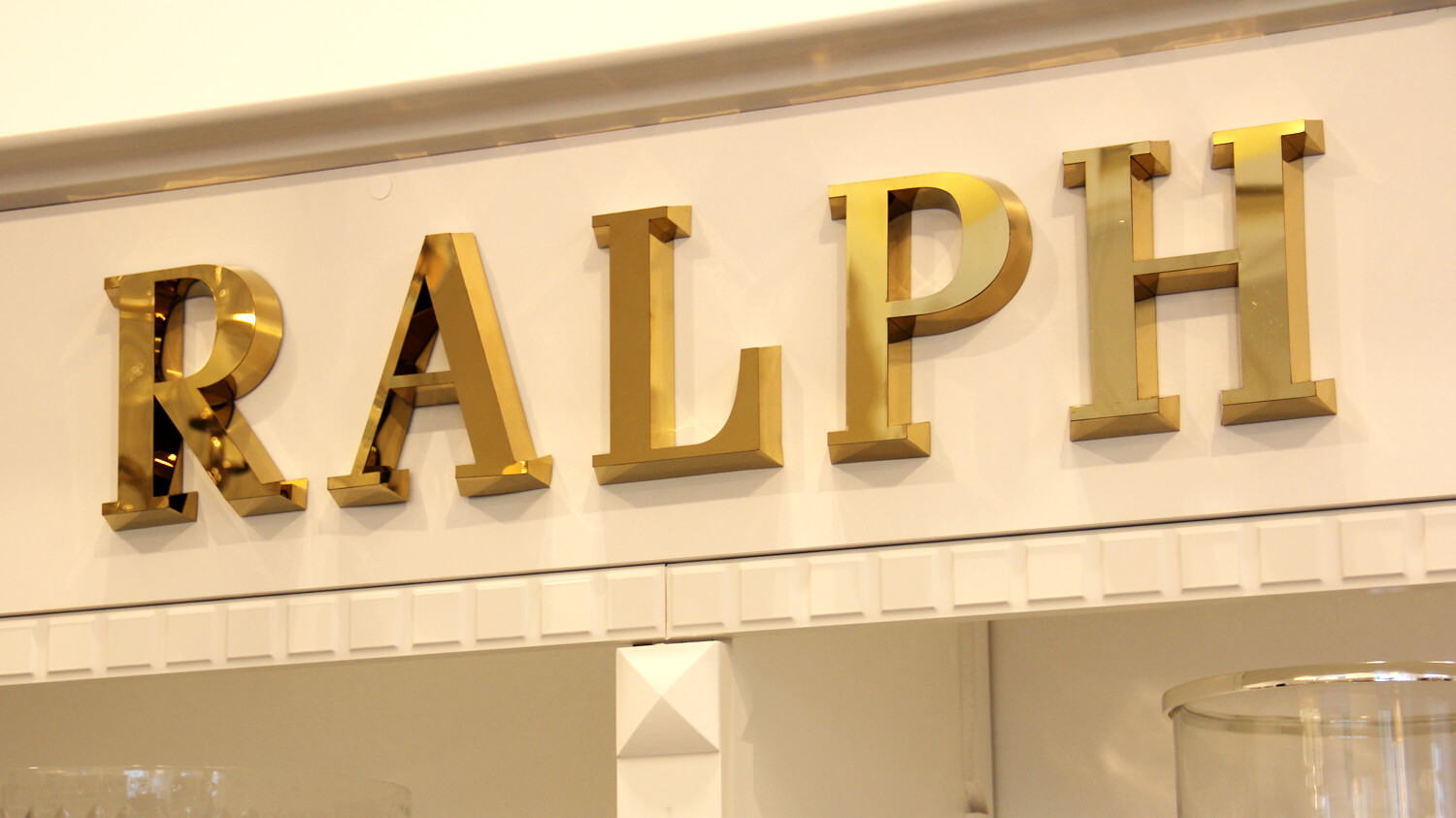 Ralph Lauren - gold spatial letters made of stainless steel sheeting