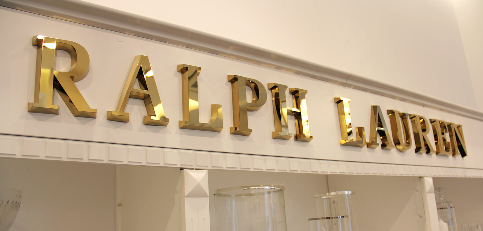 Ralph Lauren - gold spatial letters made of stainless steel sheeting