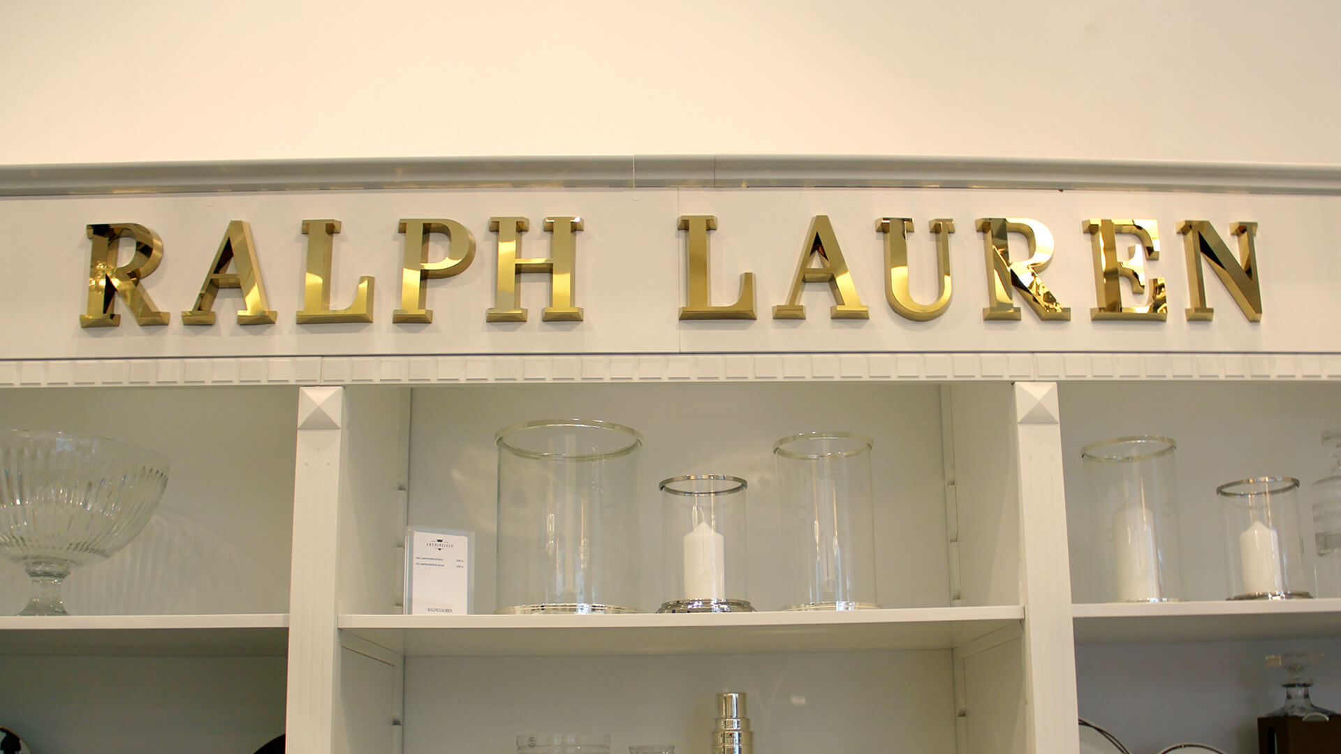 Ralph Lauren - gold spatial letters made of stainless steel sheeting