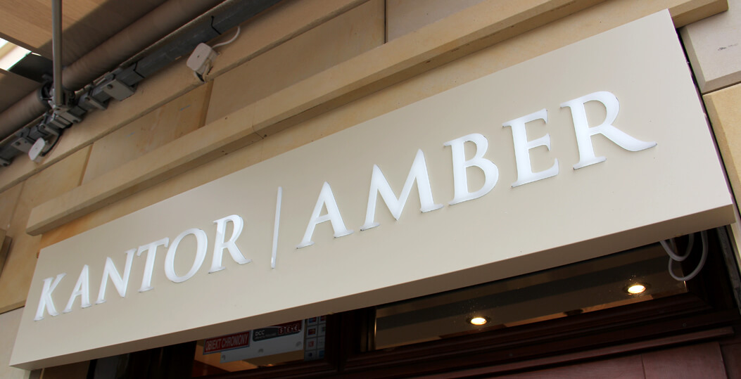 Kantor Amber - coffer, illuminated advertisement placed above the entrance