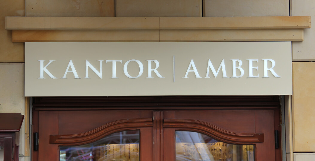 Kantor Amber - coffer, illuminated advertisement placed above the entrance