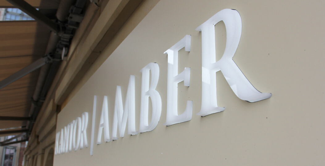 Kantor Amber - coffer, illuminated advertisement placed above the entrance