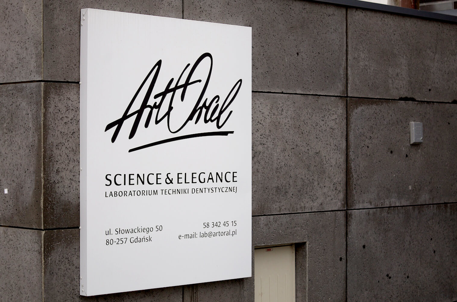 Art Oral - company's advertising coffer, sign over the entrance