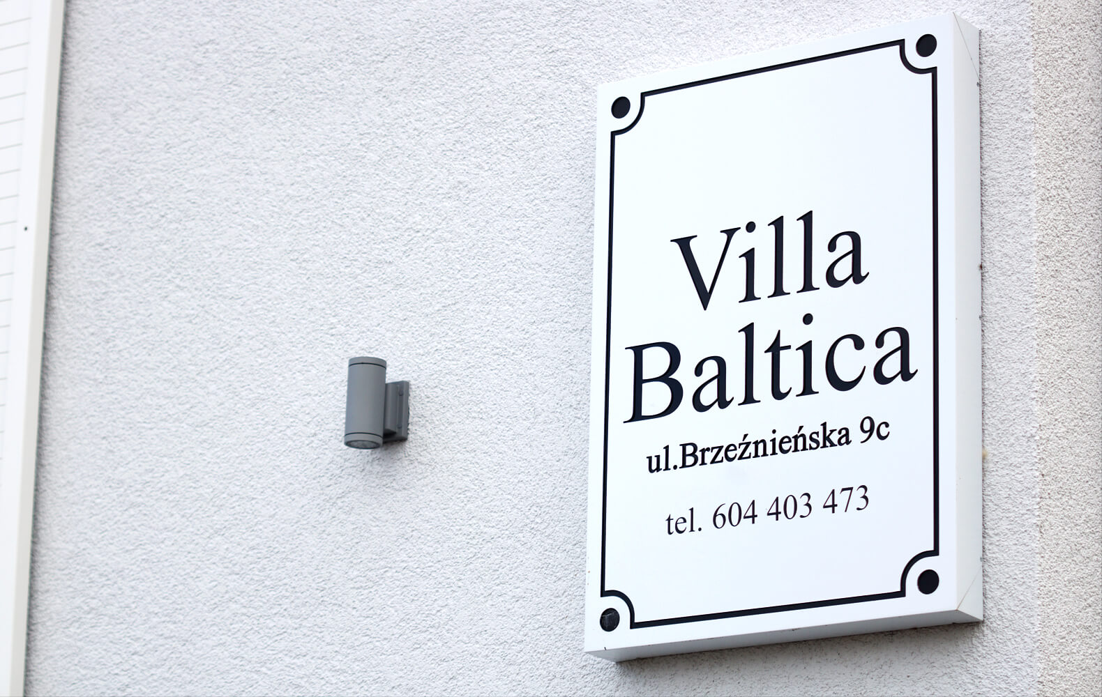 Villa Baltica - company signboard on dibond coffer in white matte color