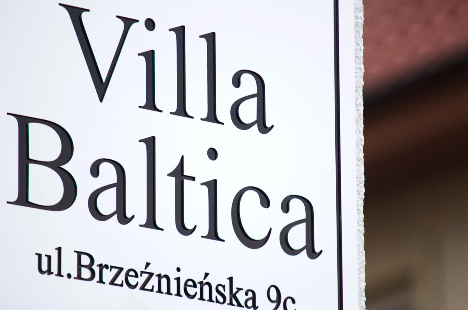 Villa Baltica - company signboard on dibond coffer in white matte color