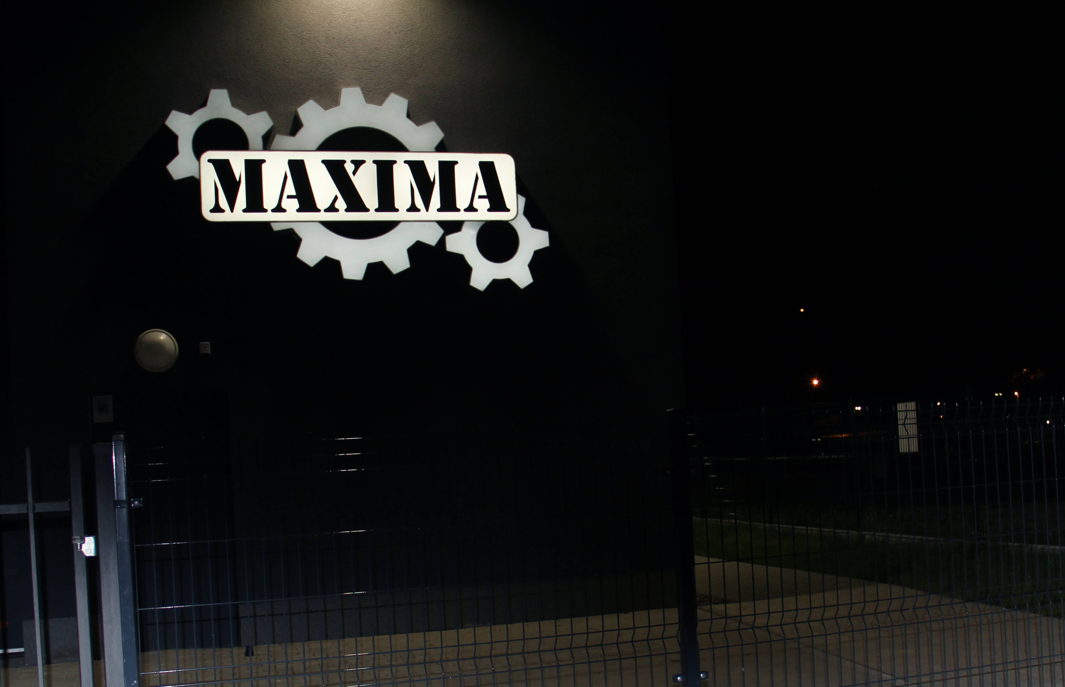 Maxima - led light box on the wall with company logo, made of plexiglass