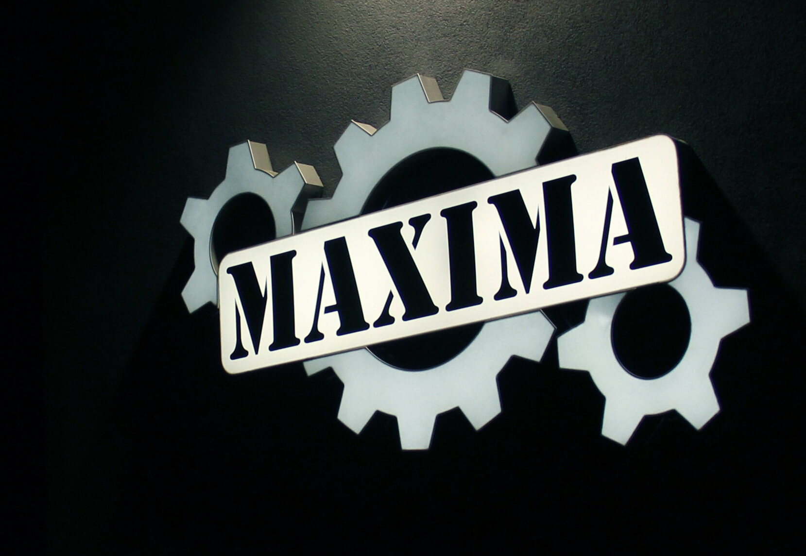 Maxima - led light box on the wall with company logo, made of plexiglass