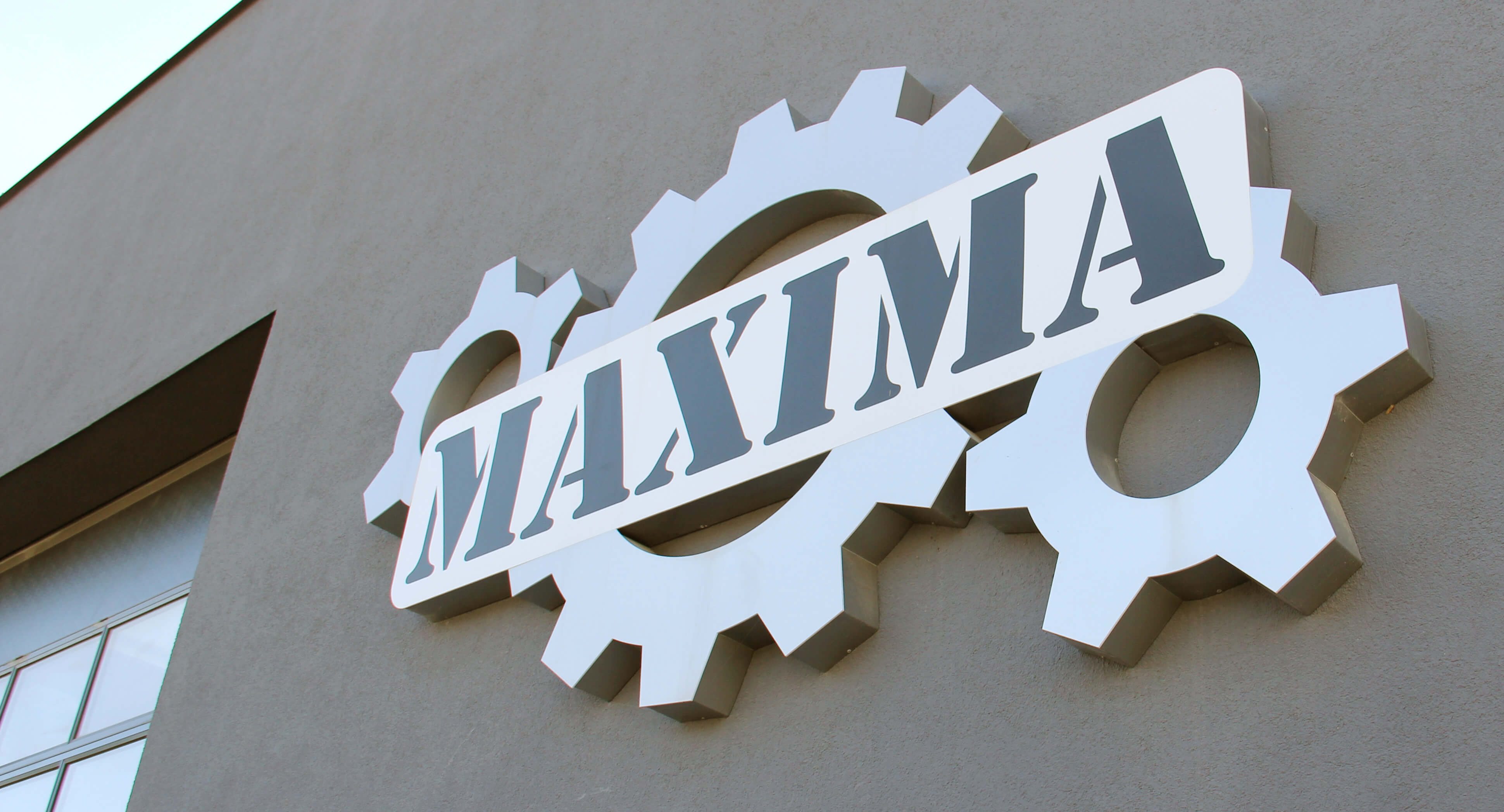 Maxima - led light box on the wall with company logo, made of plexiglass