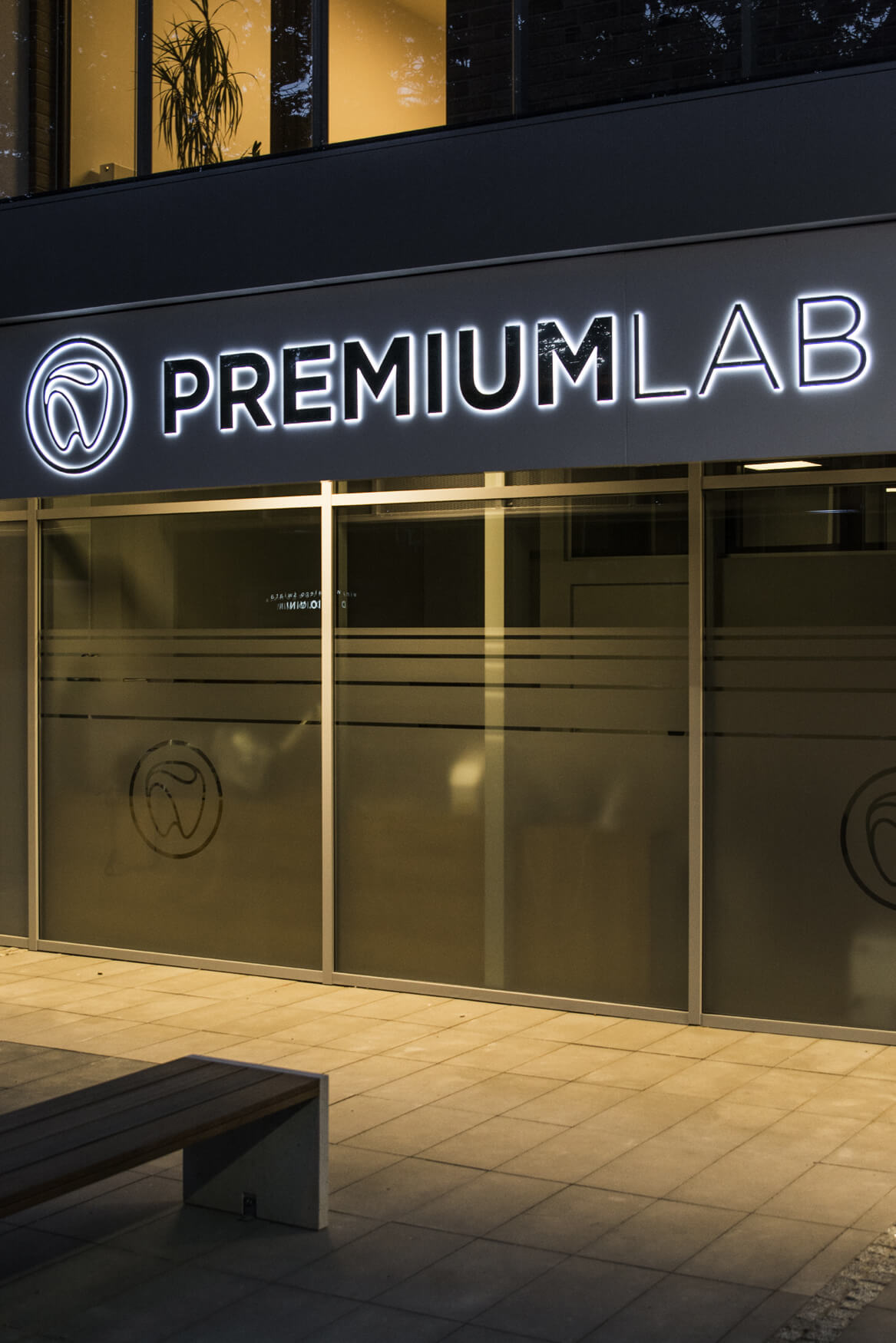 Premiumlab - a company sign placed on an advertising coffer with spatial letters made of sheet metal